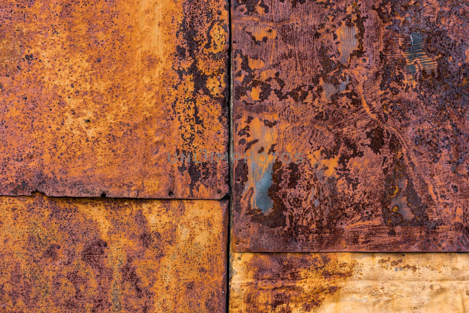 Several nailed rusted iron sheets flat background and texture