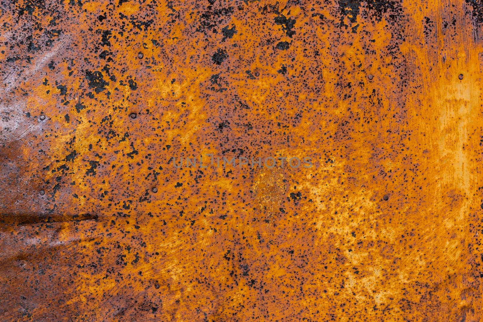 rusted flat solid sheet metal background and texture with leftovers of white paint.