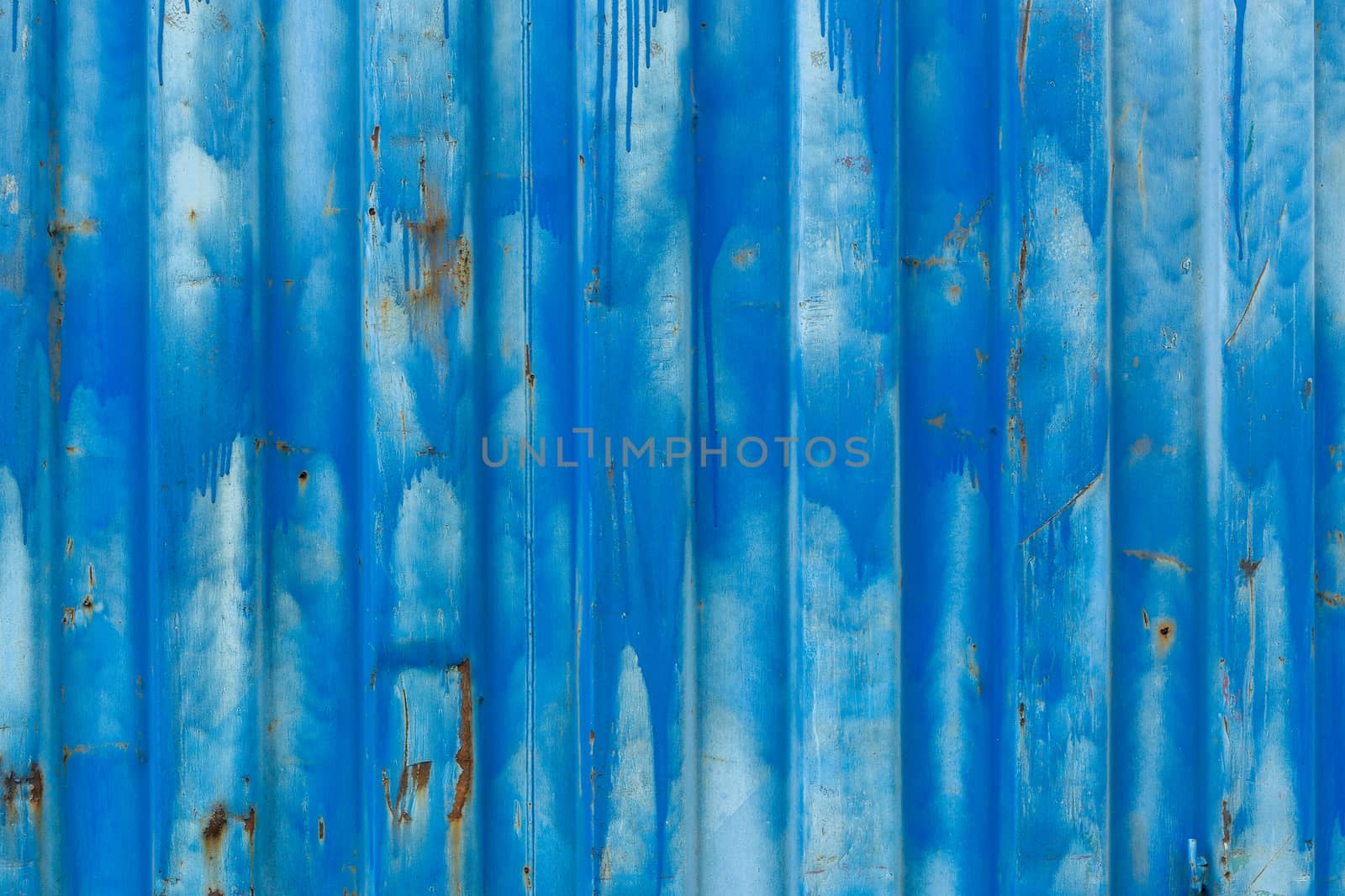 outside wall of old blue iso freight container - background and texture.