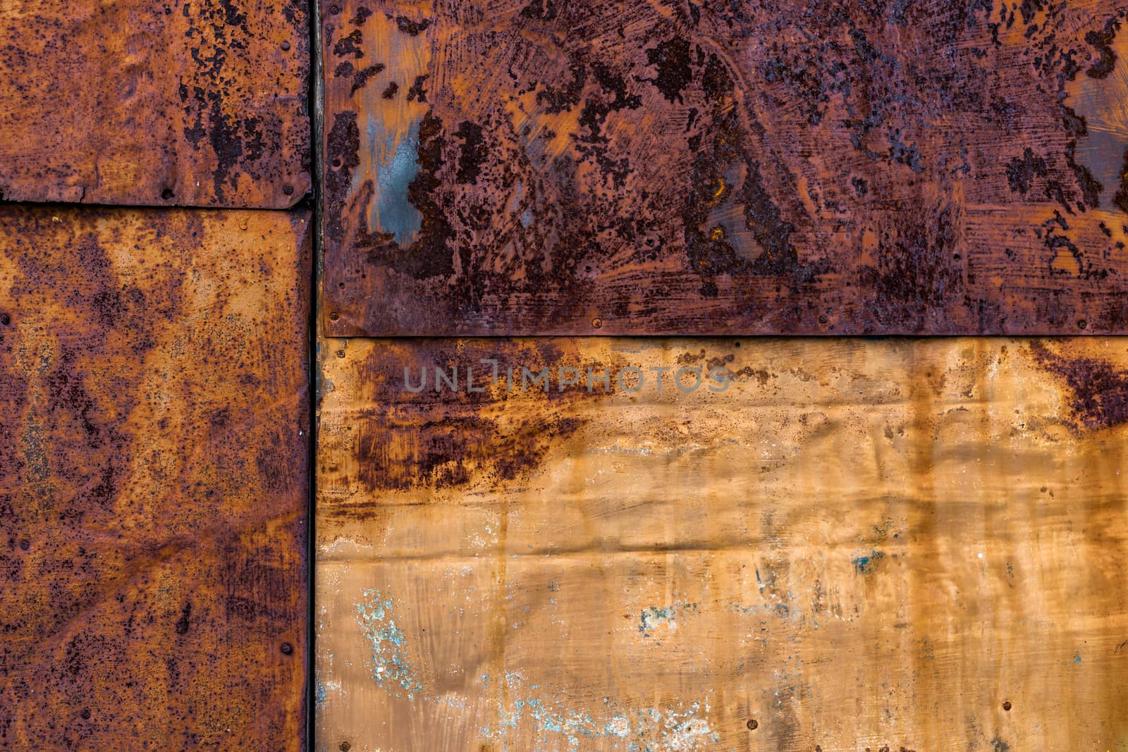 Several nailed rusted iron sheets flat background and texture