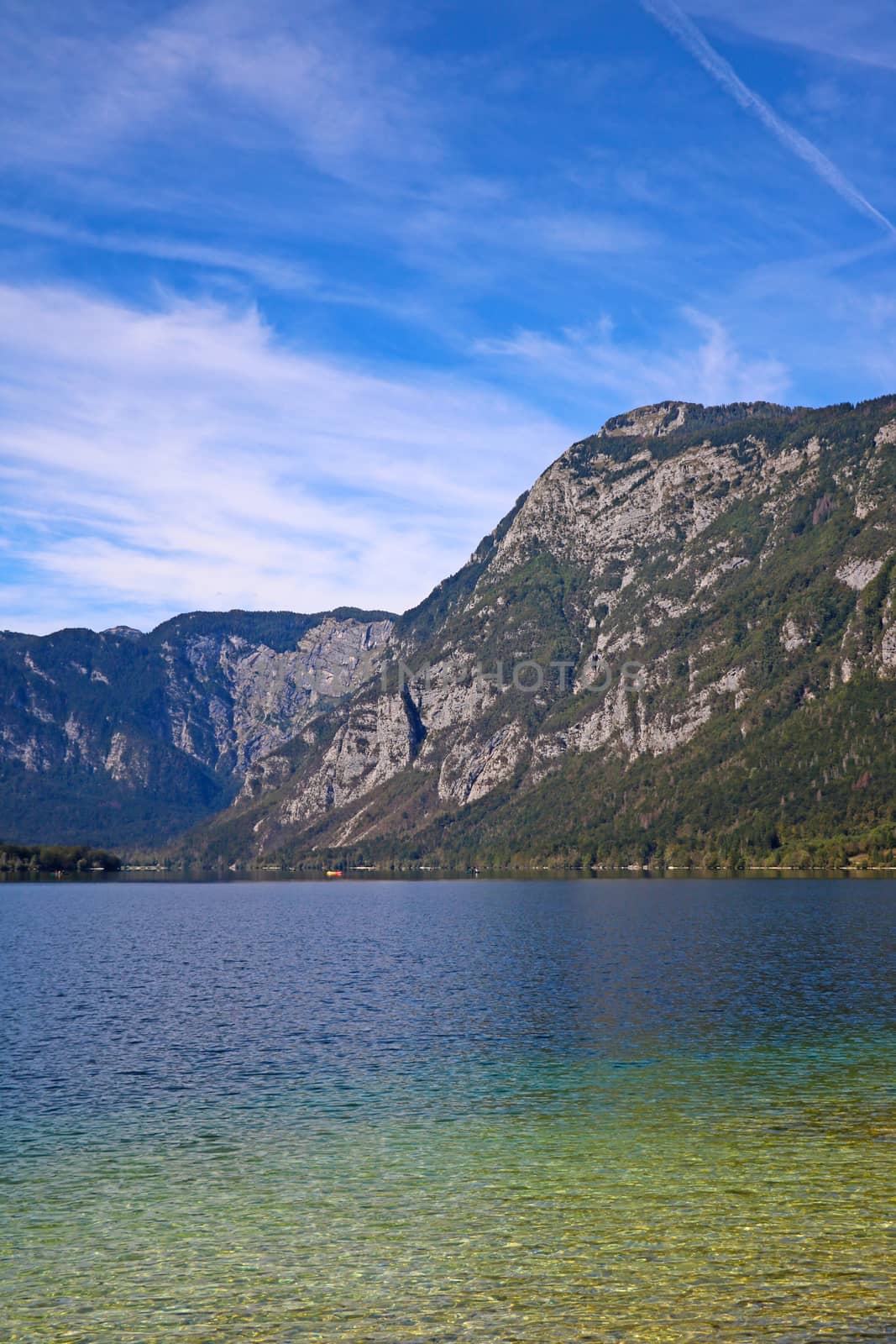 Bohinj lake shore with mountain views in Slovenia