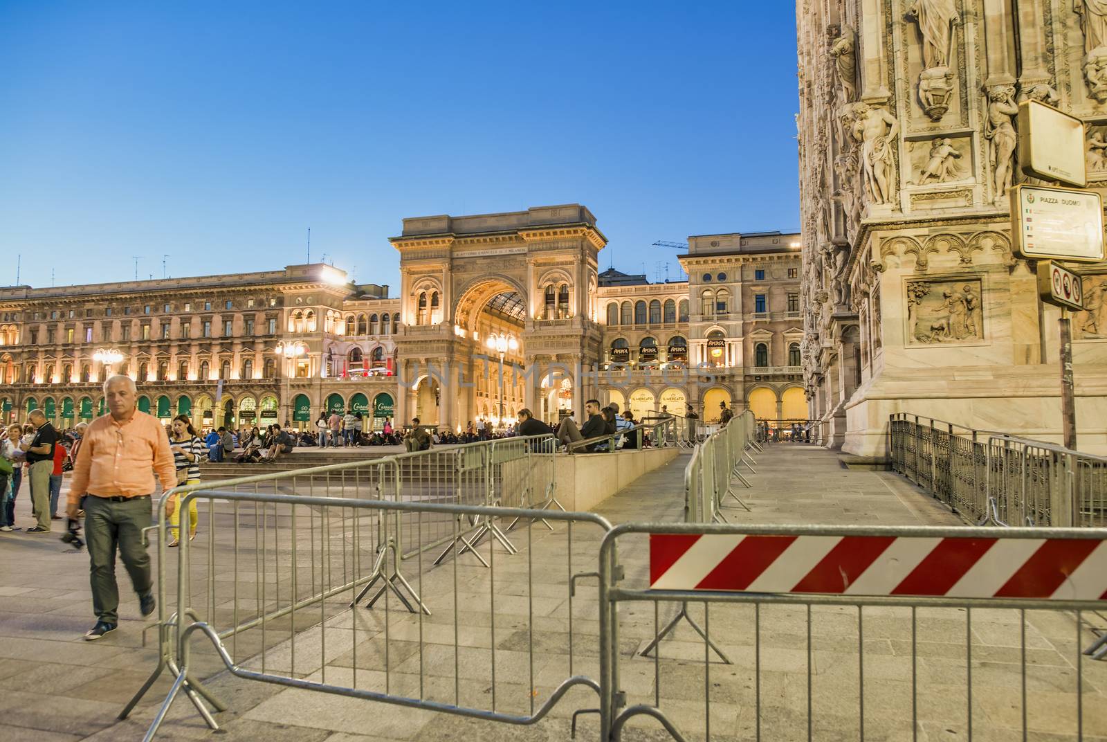 MILAN, ITALY - SEPTEMBER 2015: Tourists and locals enjoy night life in Duomo Square, city tourist center