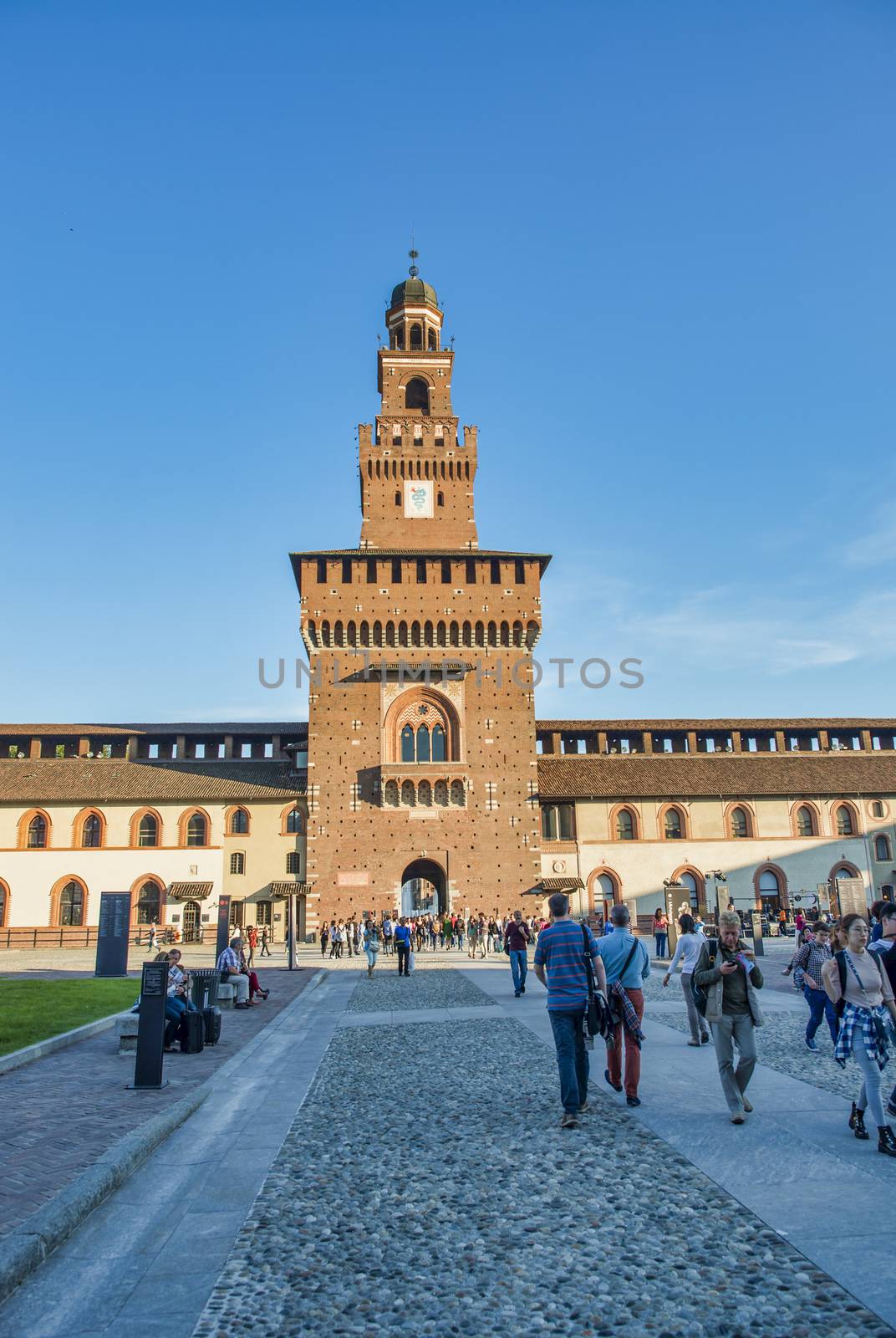 MILAN, ITALY - SEPTEMBER 2015: Tourists visit Sforza Castle and by jovannig
