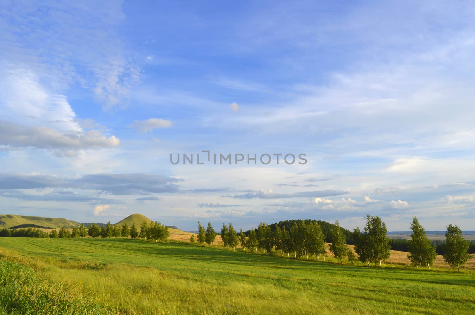 summer landscape with mountain and blue sky with clouds