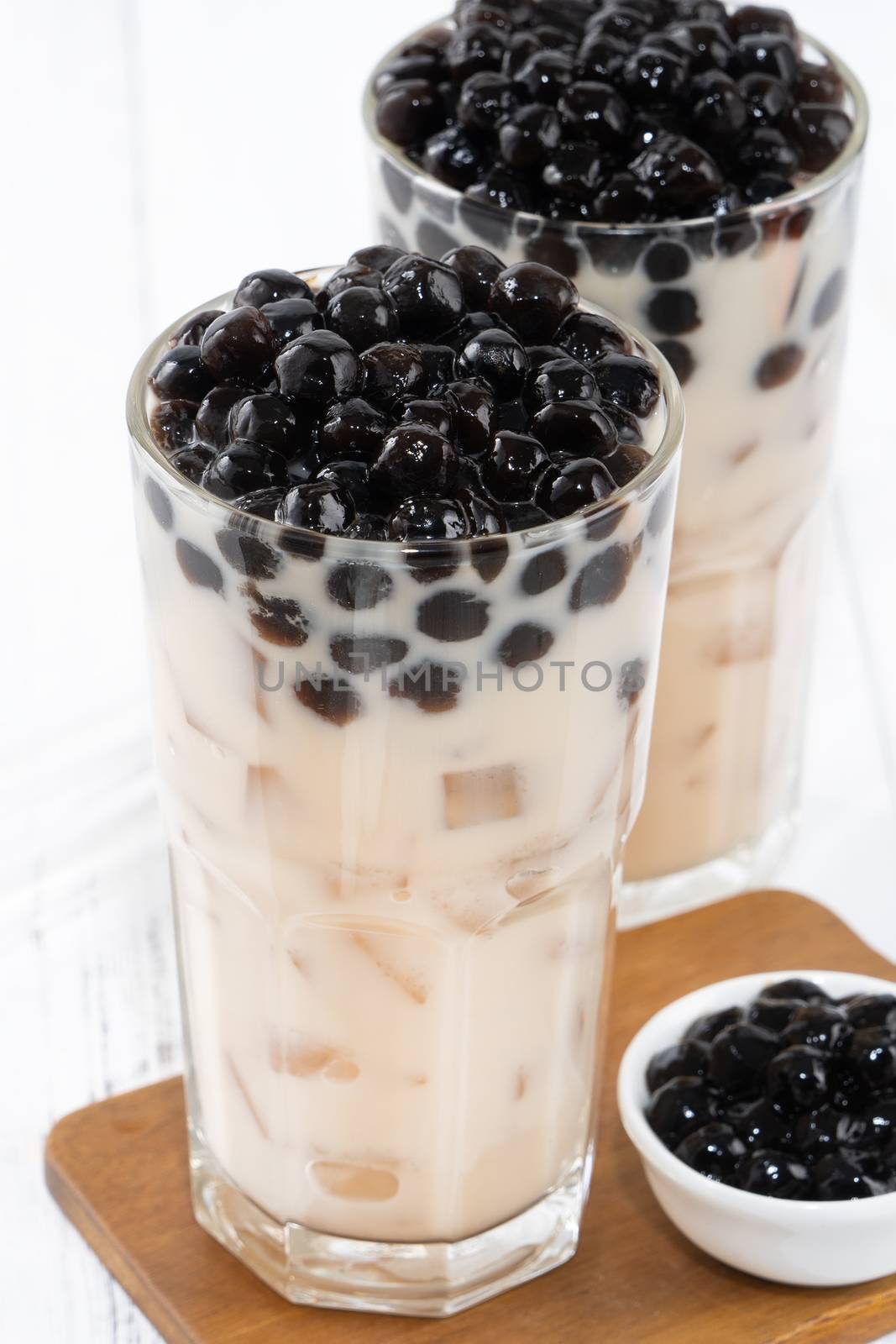 Bubble milk tea with tapioca pearl topping, famous Taiwanese dri by ROMIXIMAGE