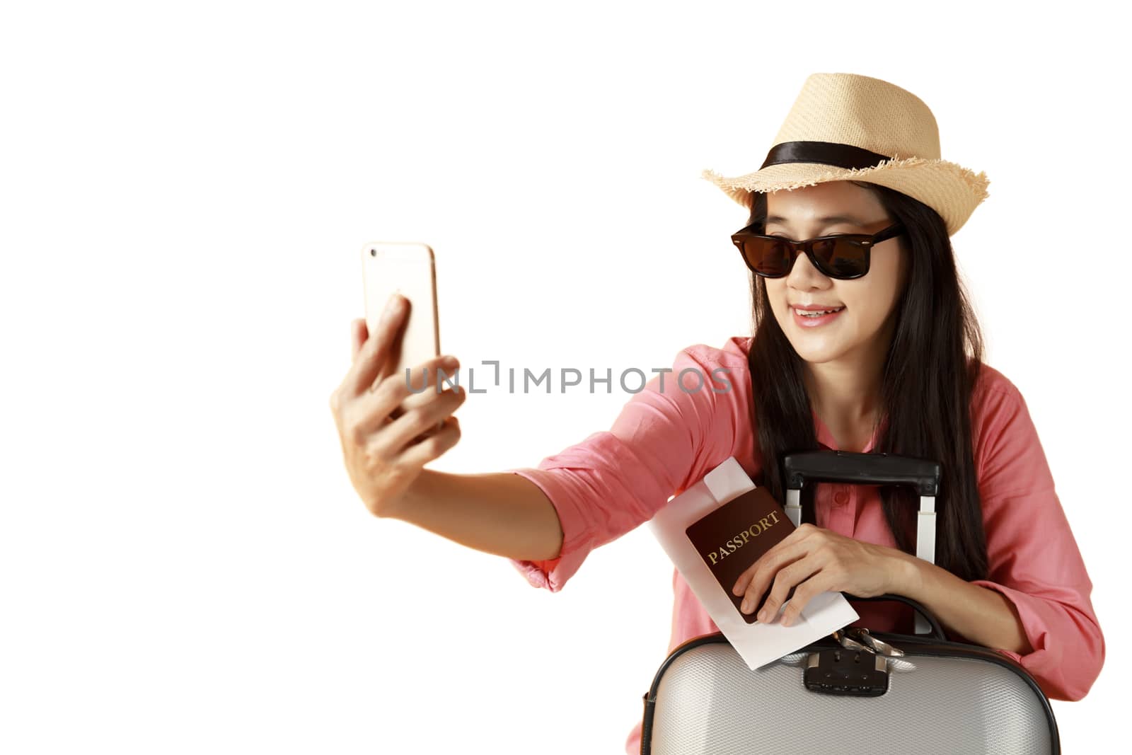 Beautiful asian woman cheerful smiling and take selfie on smart mobile phone, beauty young girl wear hat enjoy and fun in vacation isolated on white background, holiday concept. 