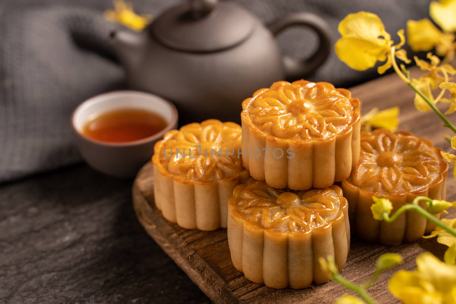 Mooncake, Moon cake for Mid-Autumn Festival, concept of traditio by ROMIXIMAGE