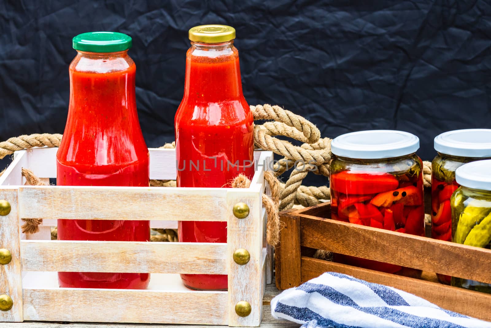 Bottles of tomato sauce, preserved canned pickled food concept i by vladispas