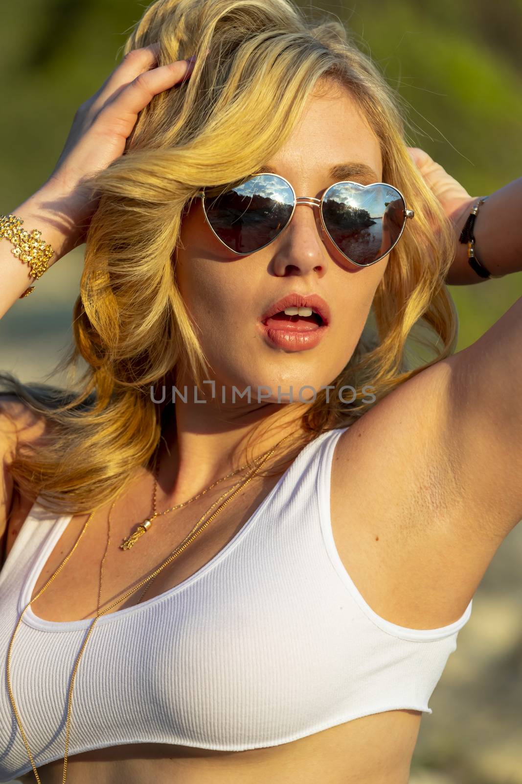 A Lovely Blonde Model Enjoys A Summers Day Outdoors At The Park by actionsports