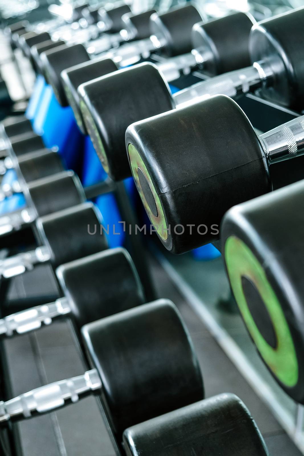 Close up image of Fitness equipment dumbbells weight,Gym background