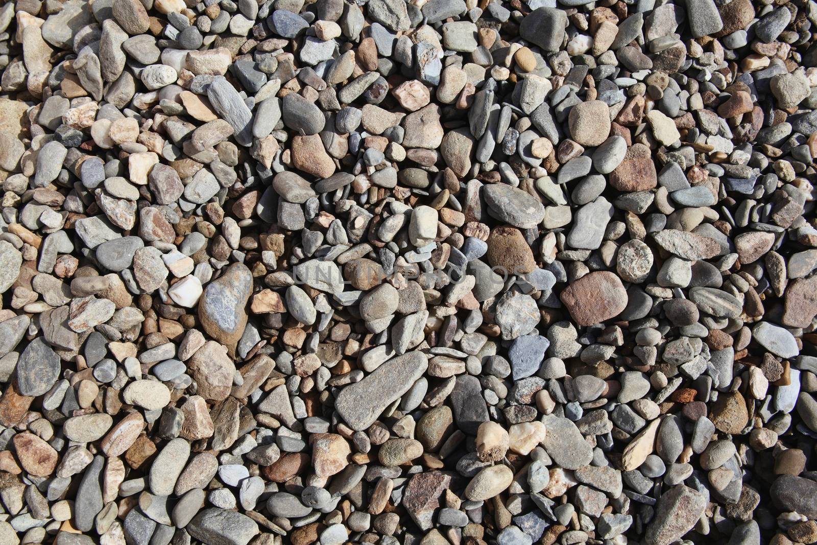 Background texture of rock pebble stones used for landscaping stock photo