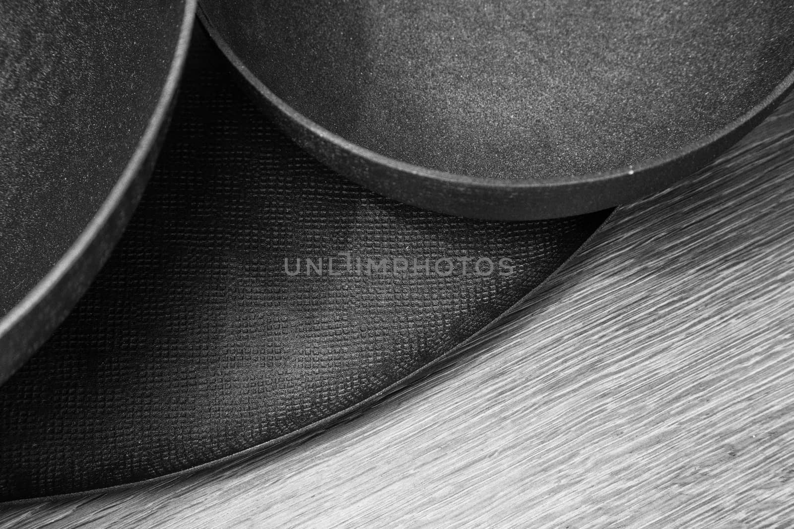 Three empty decorated metal bowls on a table