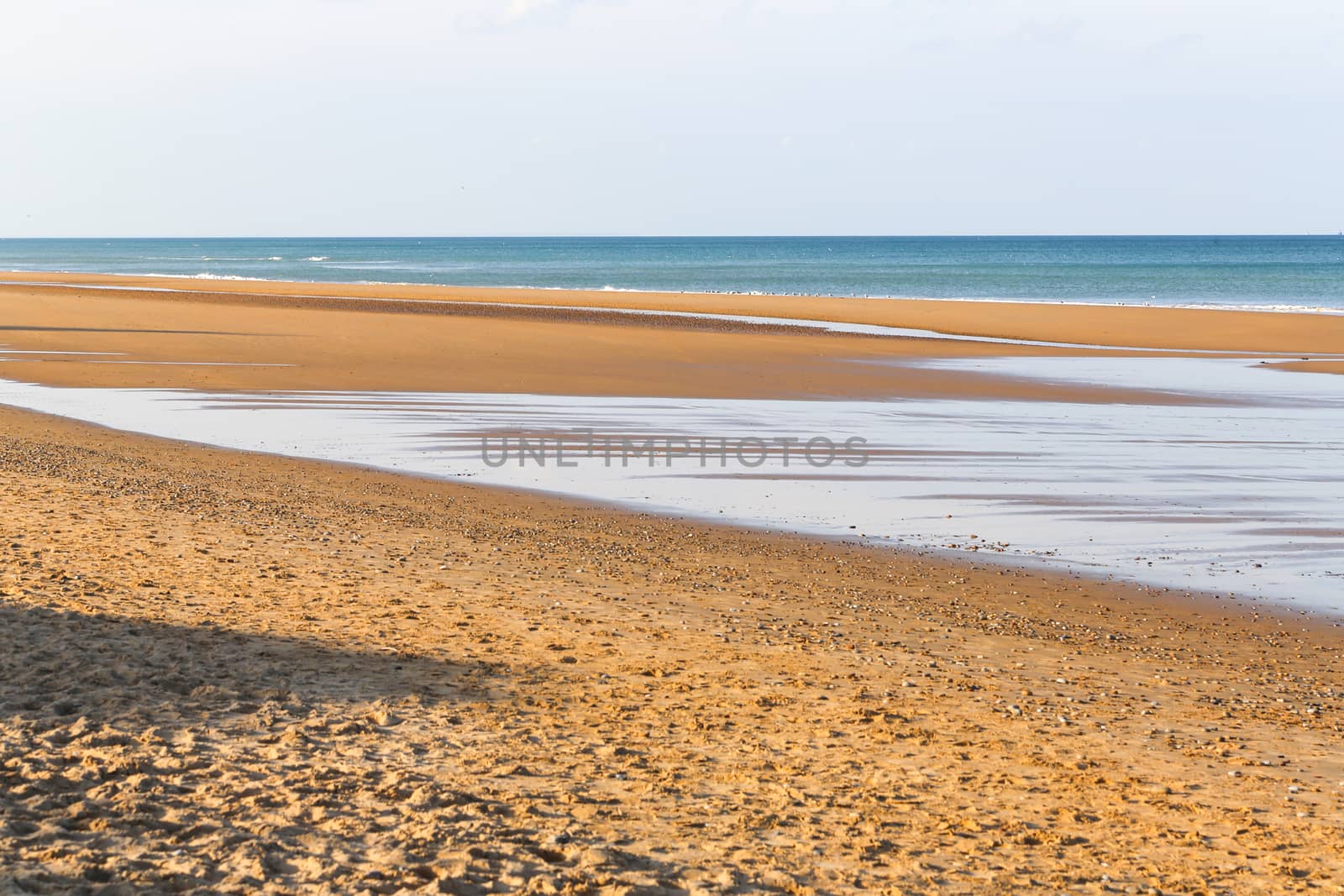 Ruins of harbor built by the Allies in Arromanches, Normandy, France