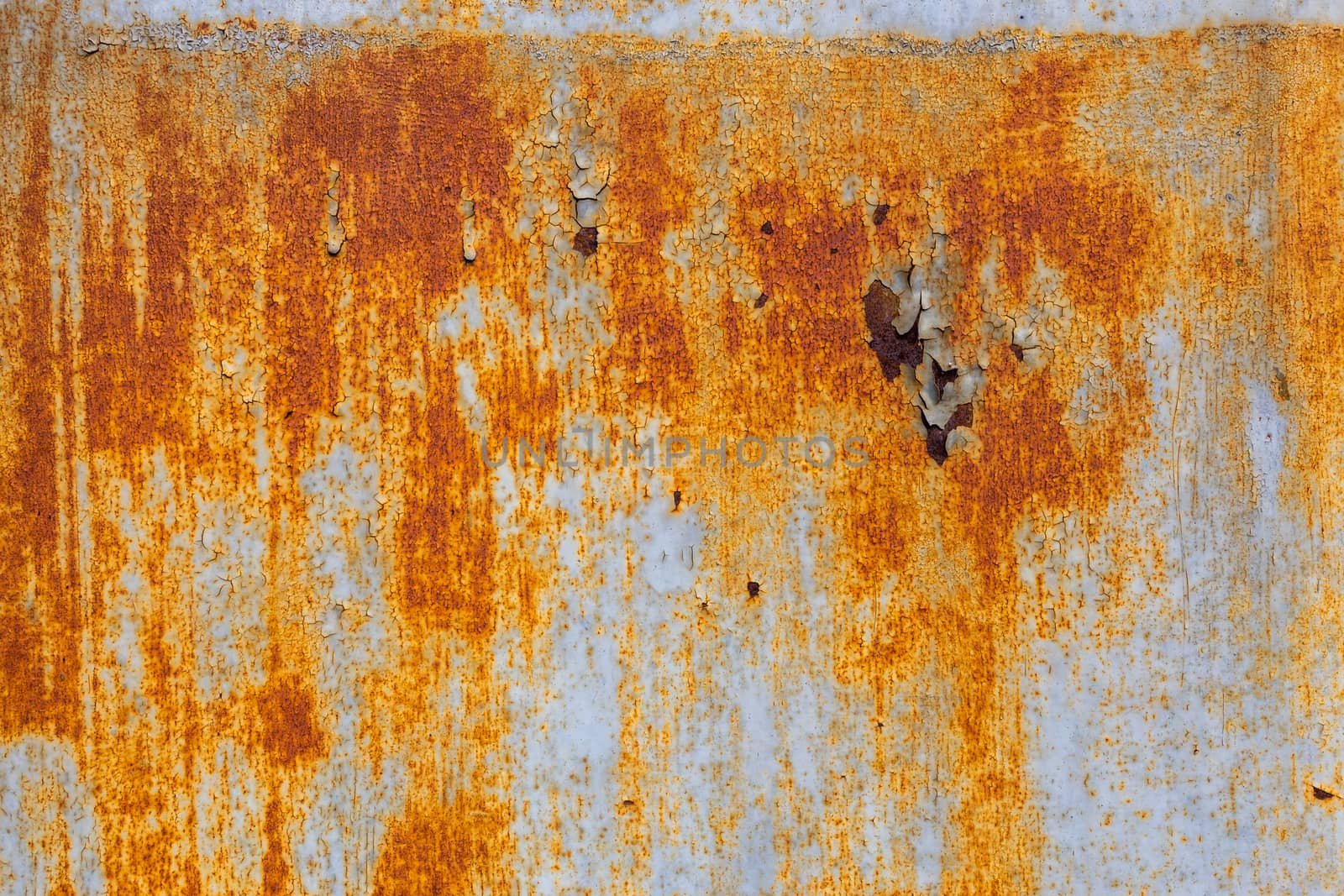 abstract background and texture of white steel surface with orange rust stains.
