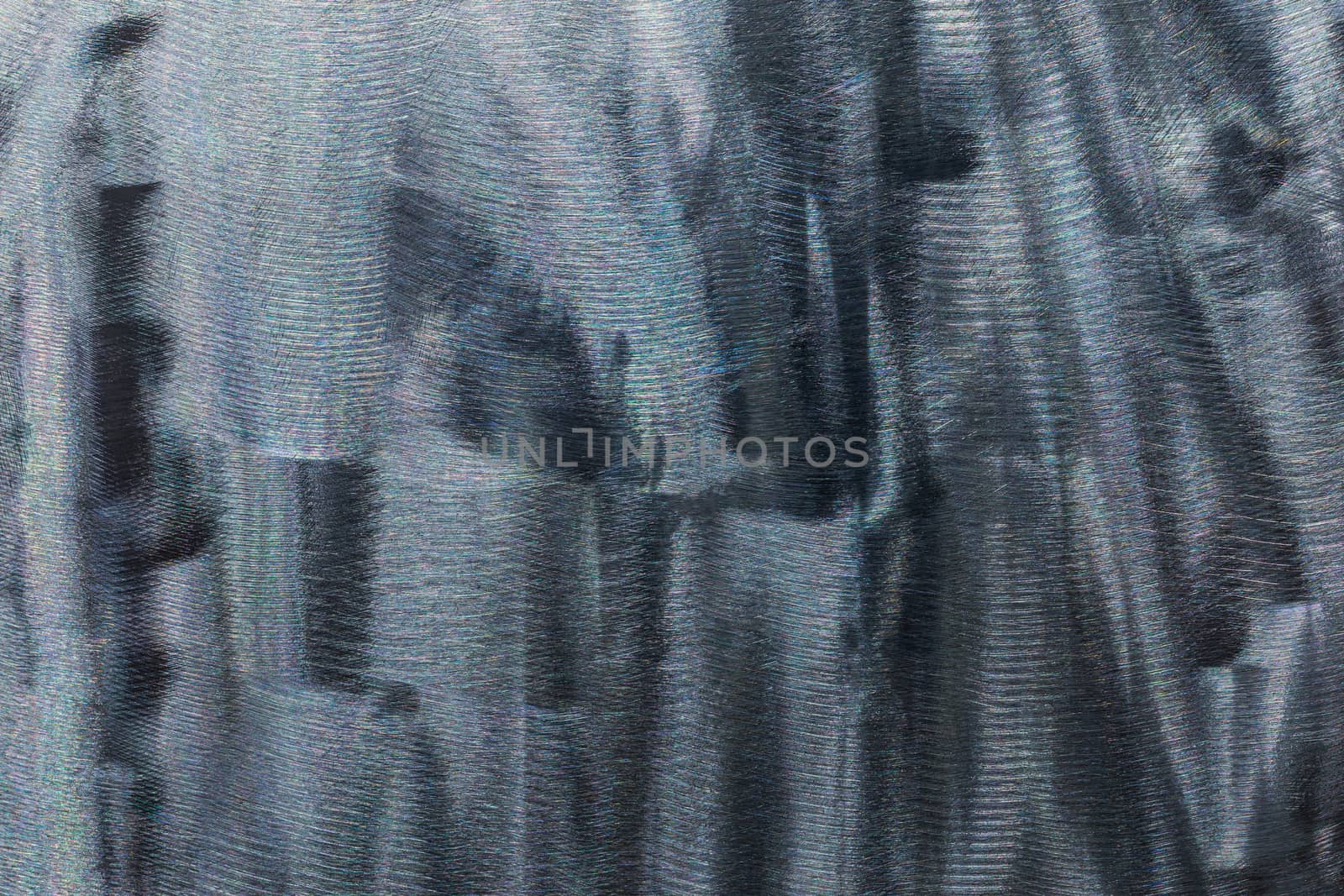 Close-up texture of flat steel surface manually cleaned with a flap wheel angle grinder. by z1b