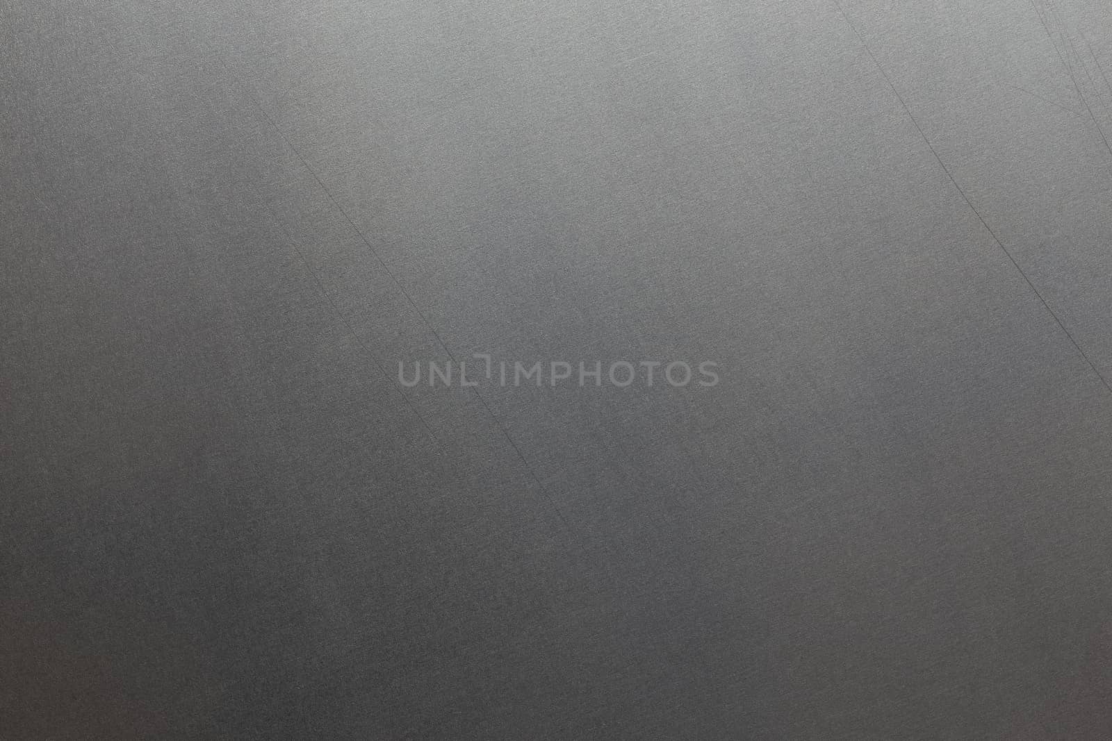 Uncoated flat cold rolled steel sheet surface with minor long scratches. Close-up in directly above composition. by z1b