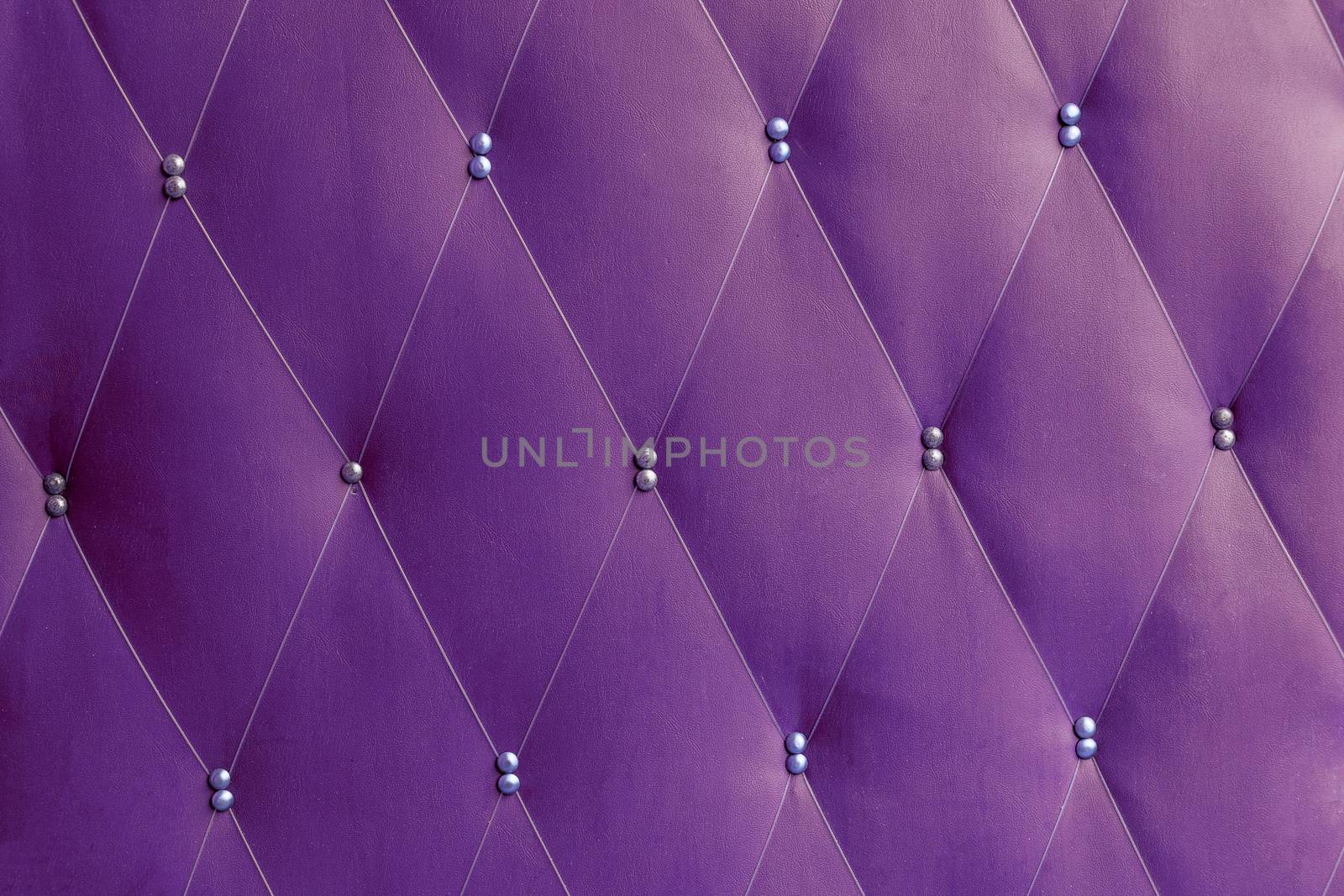 Soviet soft purple dermantine front door with a banner of fishing line and nails - full frame background and texture.