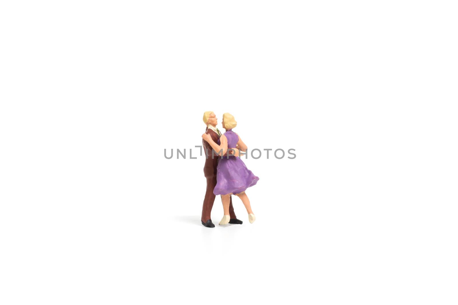 Miniature people, Couple romantic dancing on white background , Valentine's day concept