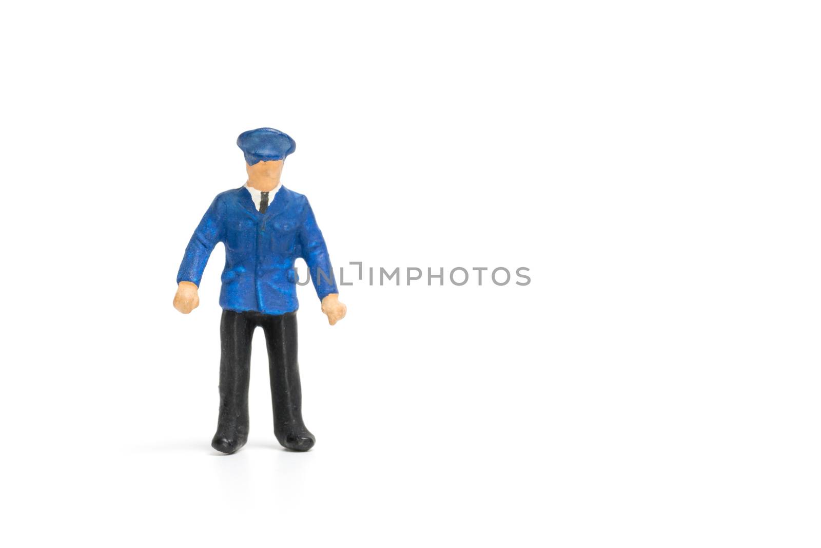 Miniature people : Policeman standing isolate on white background