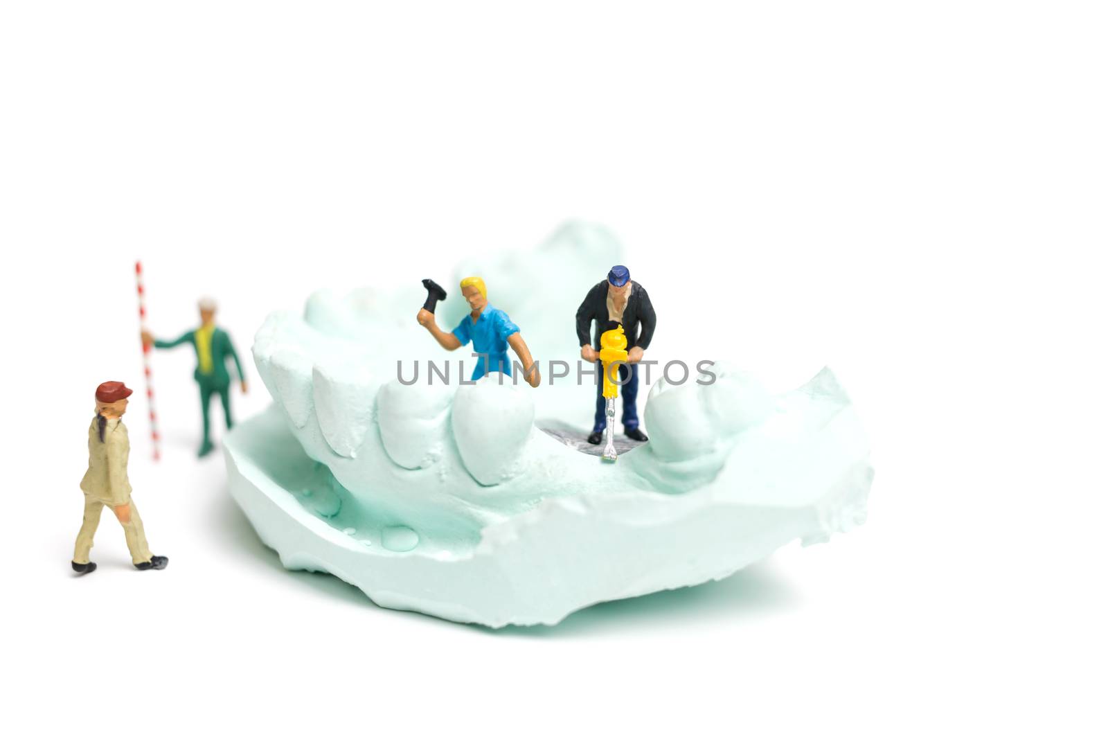 Miniature Worker team is filing fake teeth by sirichaiyaymicro