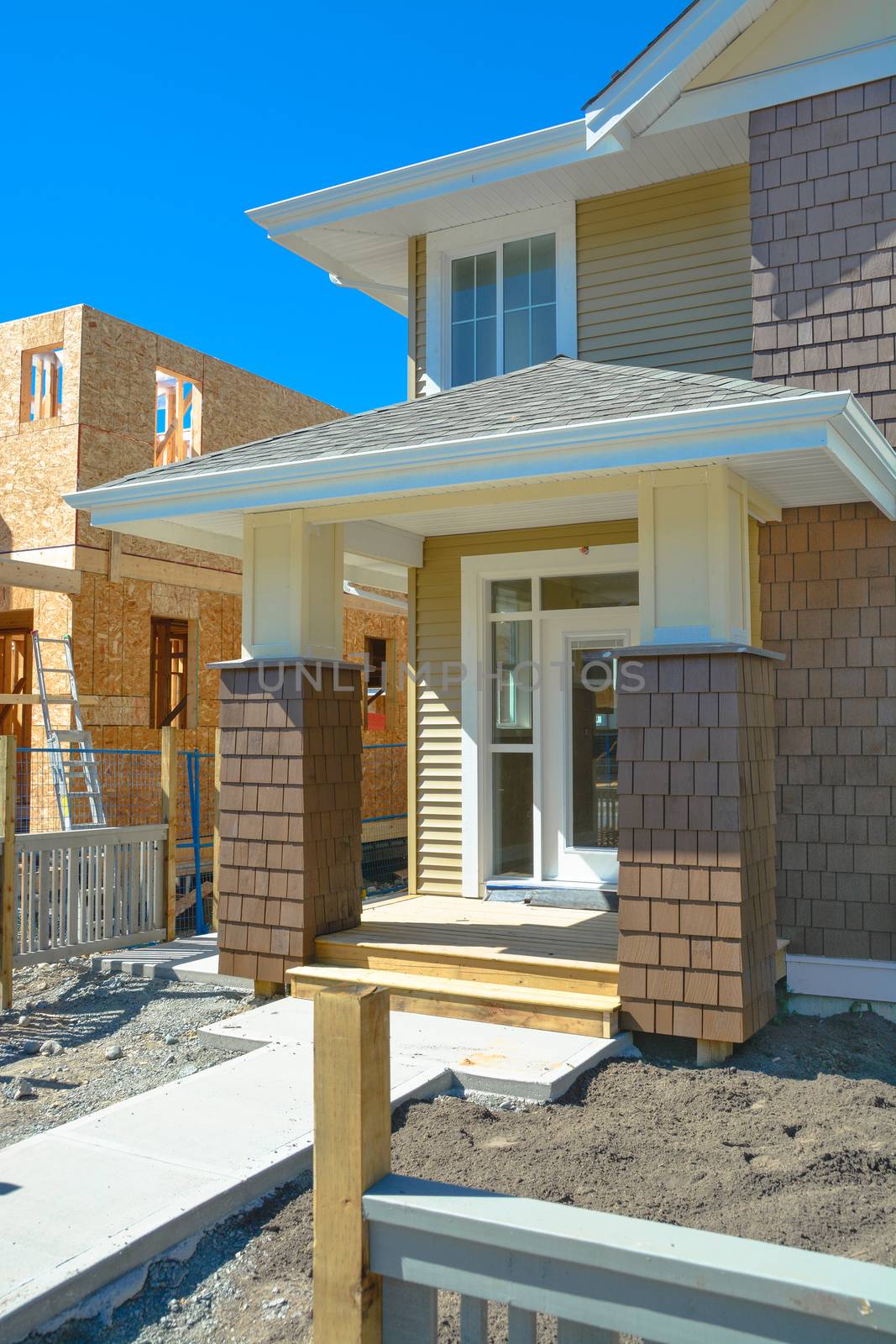 Entrance door of brand new family townhouses on construction completion stage