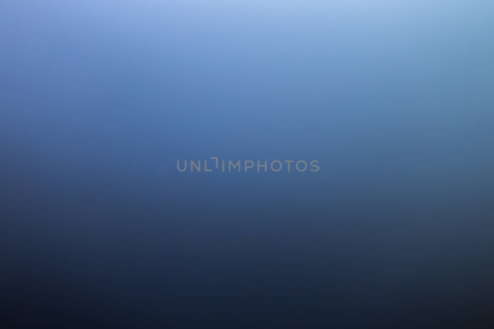 abstract black to blue gradient photographic blur background.