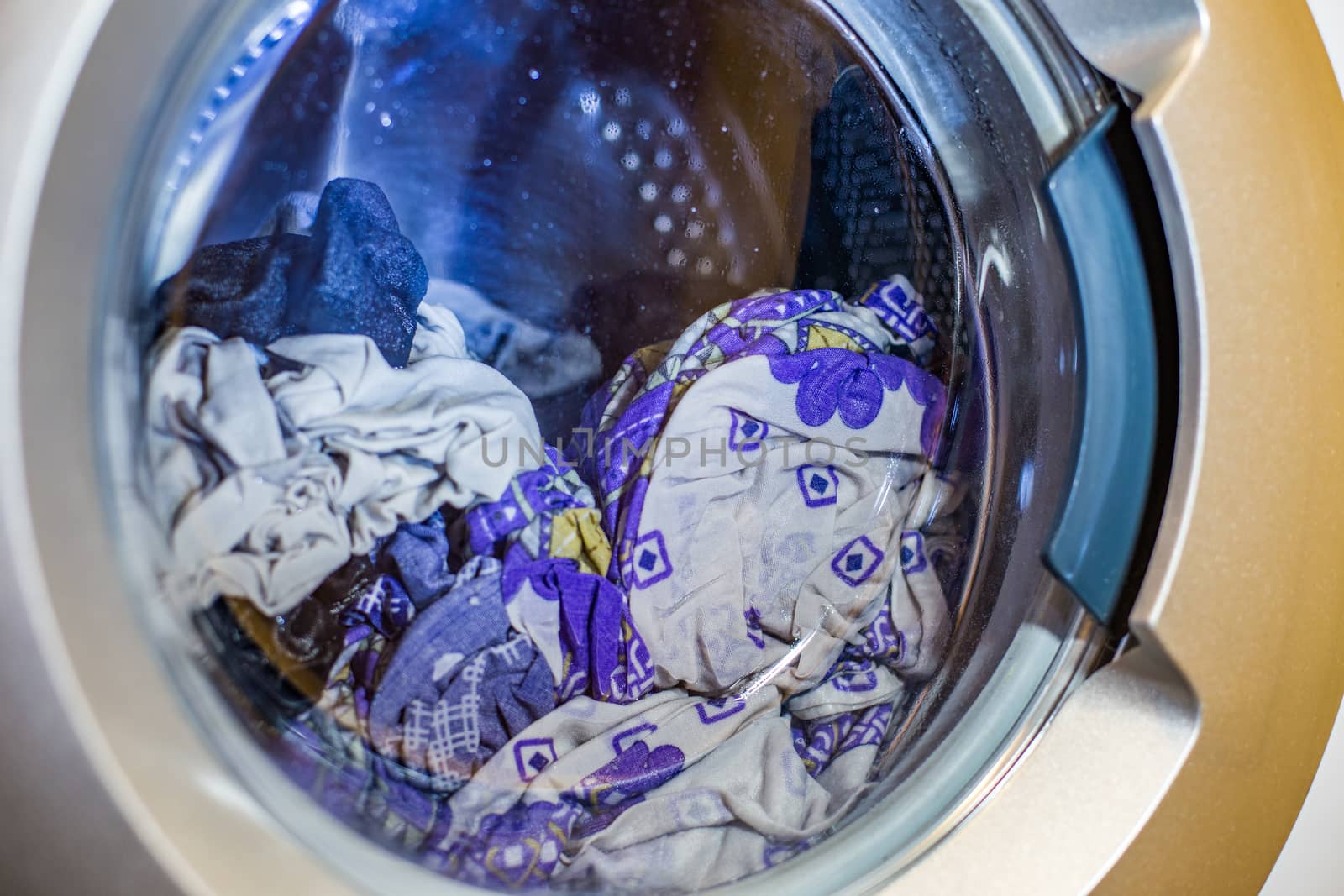 a close view of domestic washing machine at work by z1b