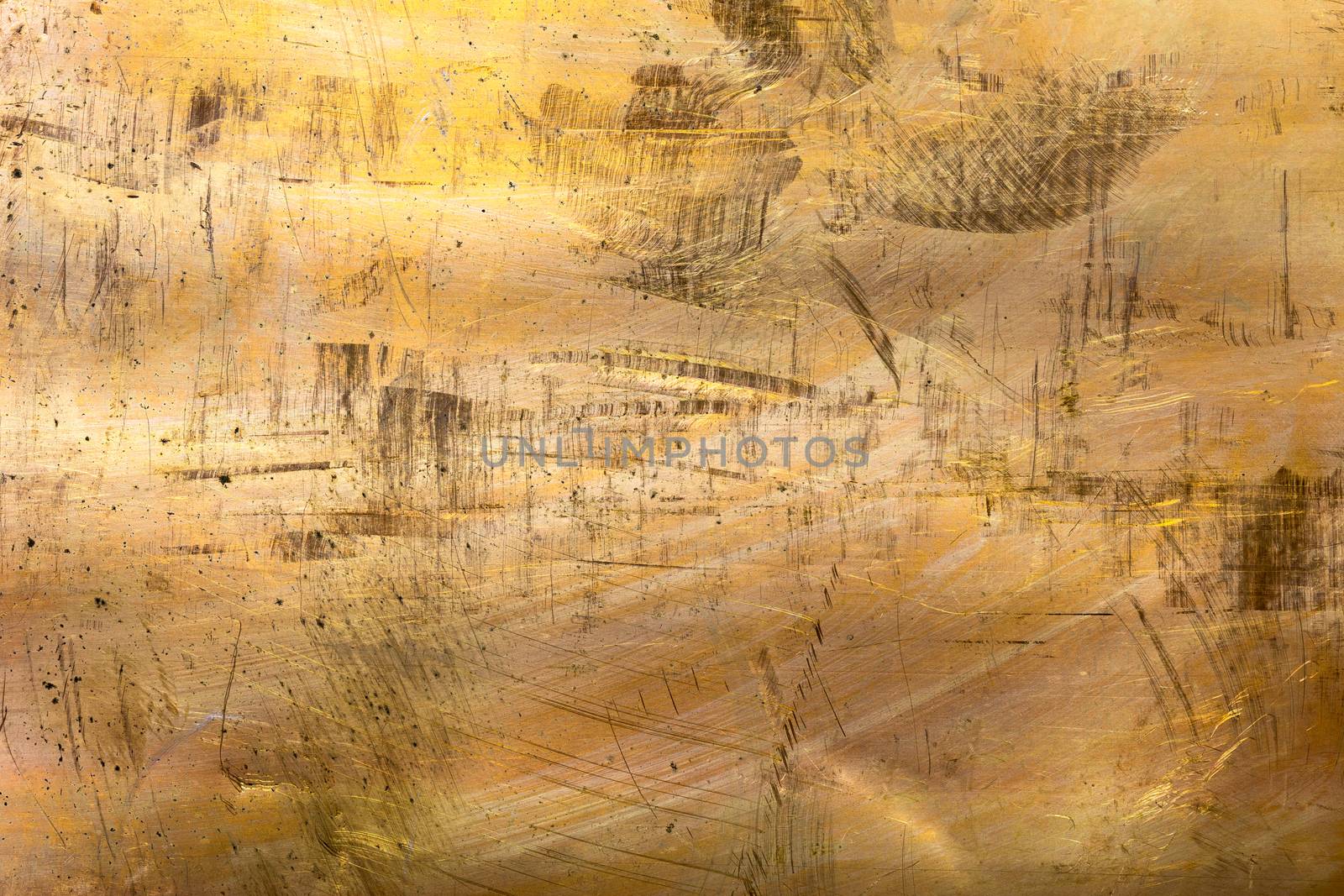 full frame scratched brass sheet texture and close-up background