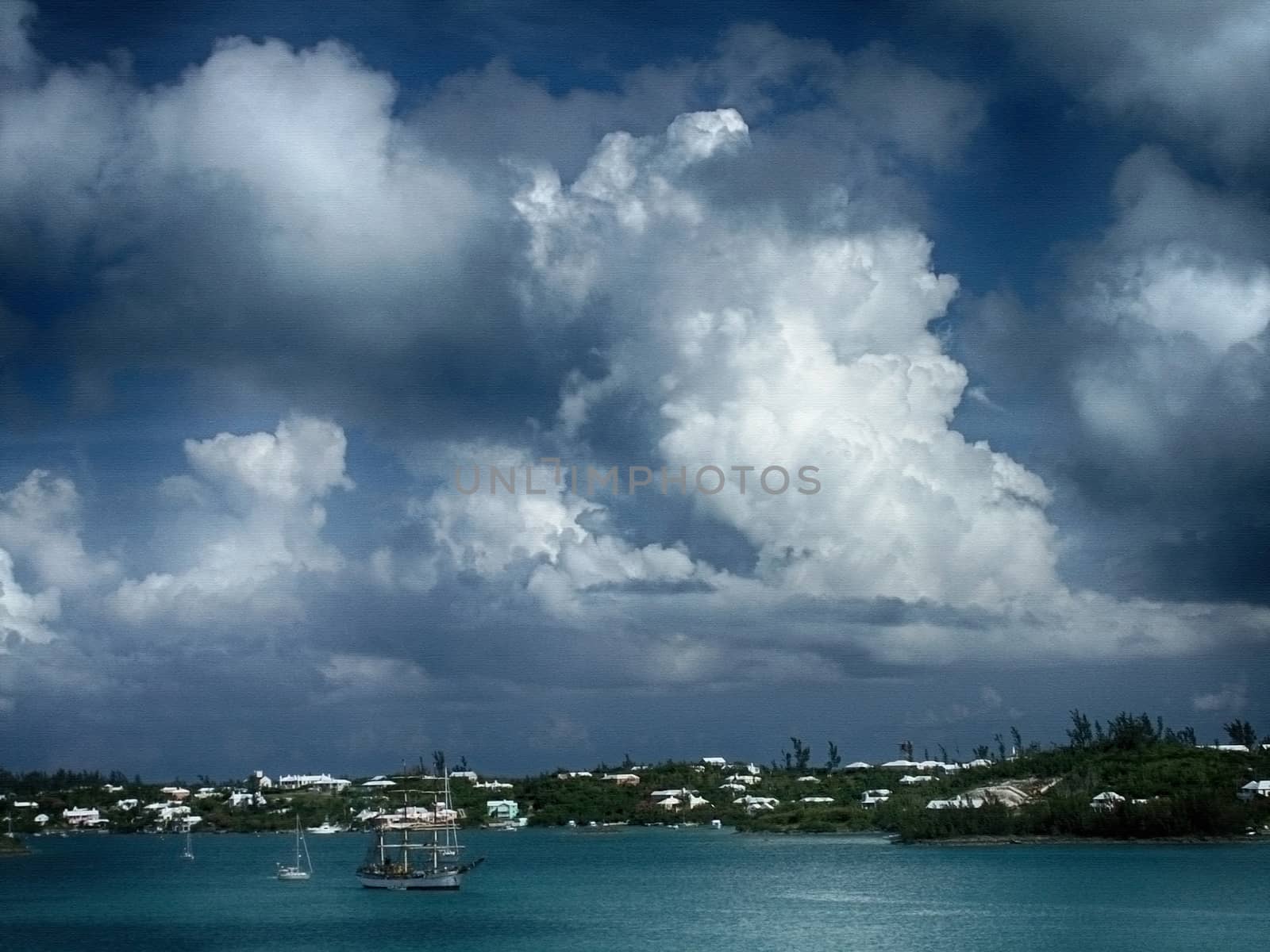 Clouds over beautiful bay with sailboats