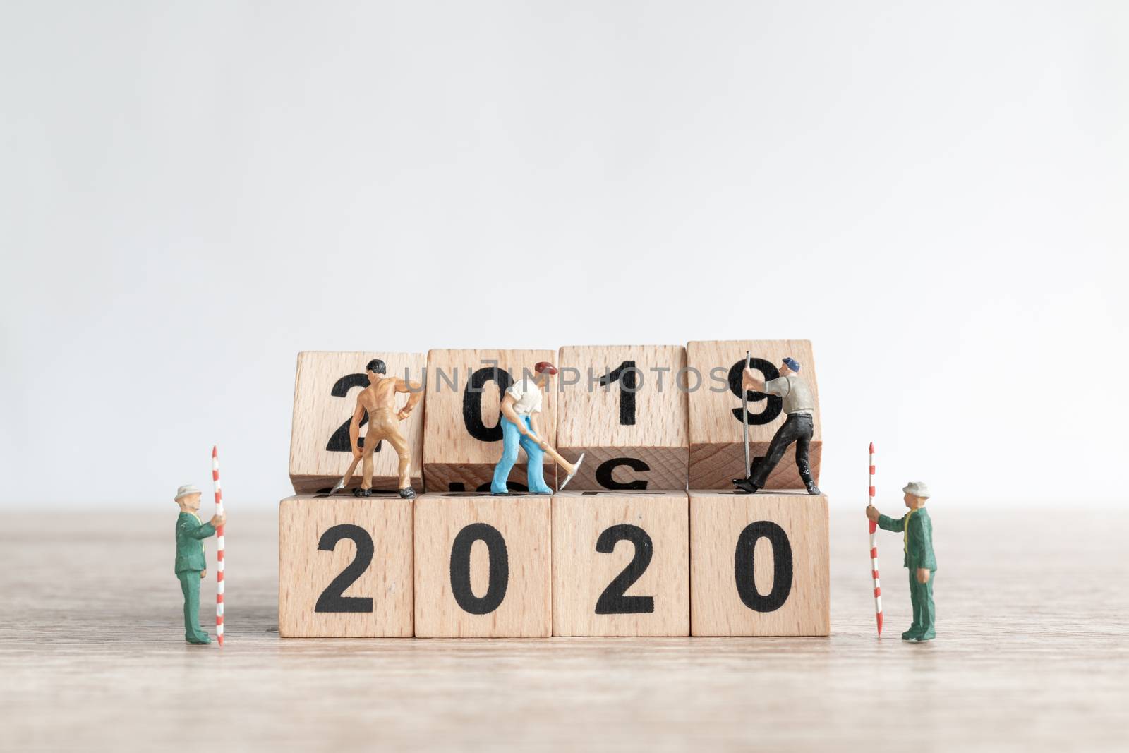 Miniature worker team create number 2020 and remove number 2019  , Happy new year 2019 concept