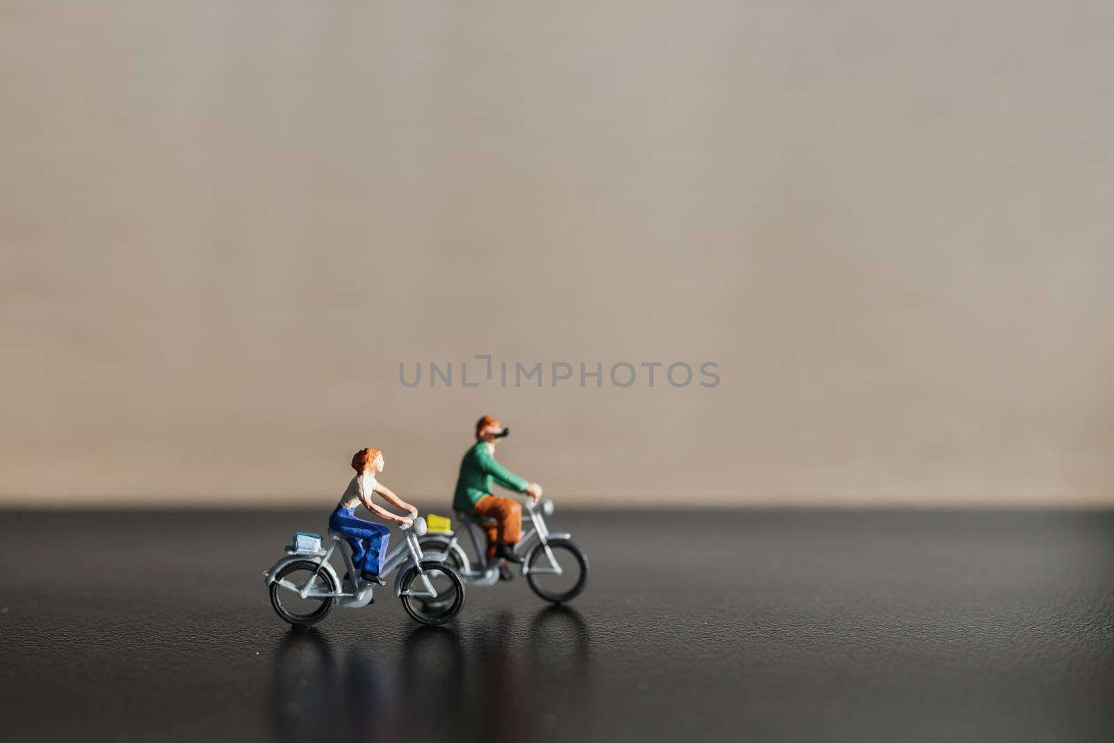 Miniature people : Travelers riding bicycle , Healthy lifestyle concept