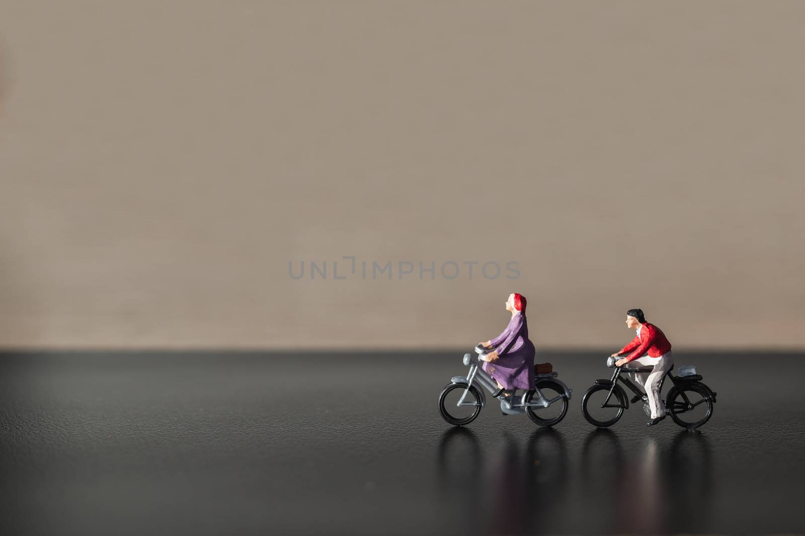 Miniature people : Travelers riding bicycle  by sirichaiyaymicro