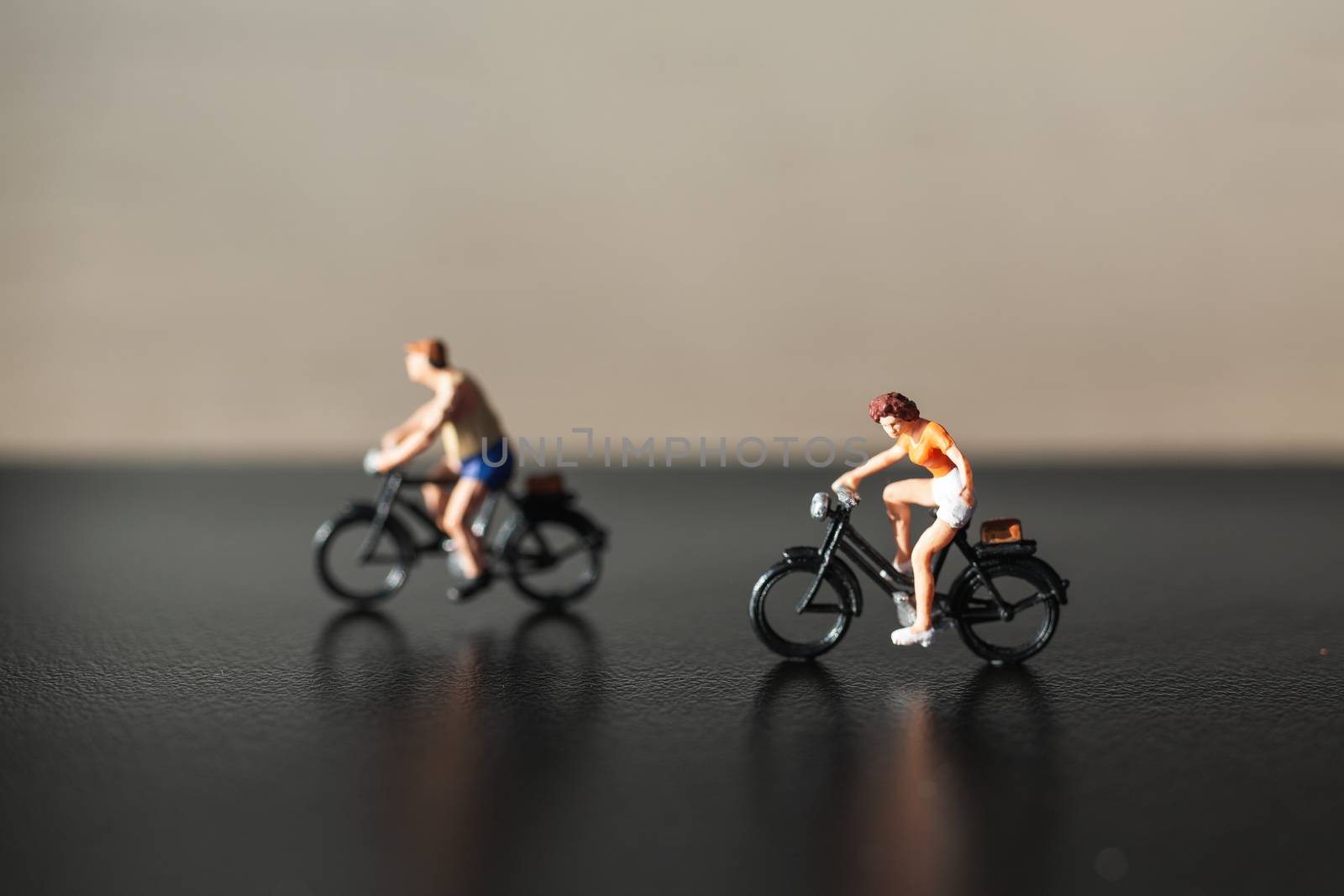 Miniature people : Travelers riding bicycle  by sirichaiyaymicro