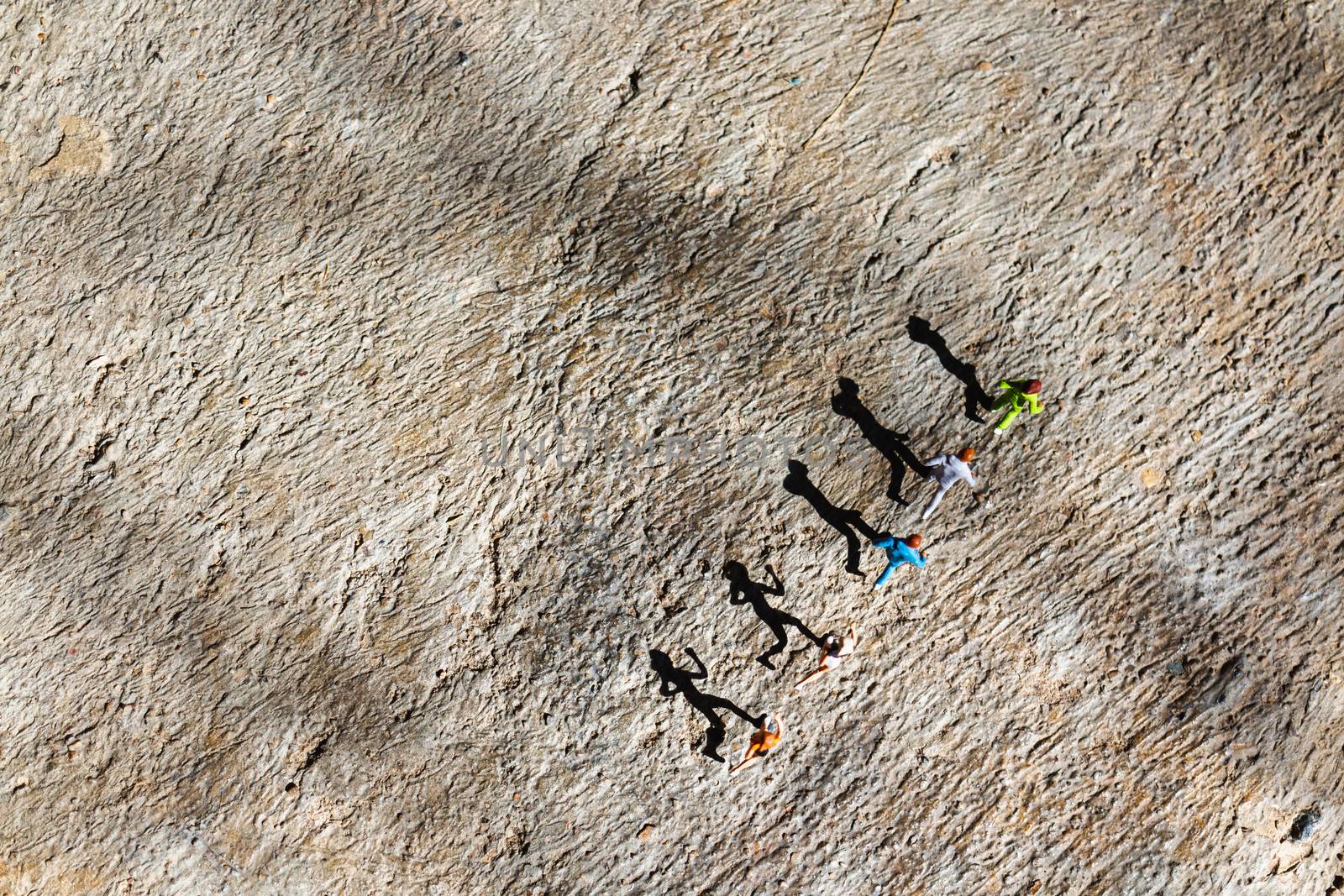 Miniature people : Group of people are running  on concrete floo by sirichaiyaymicro