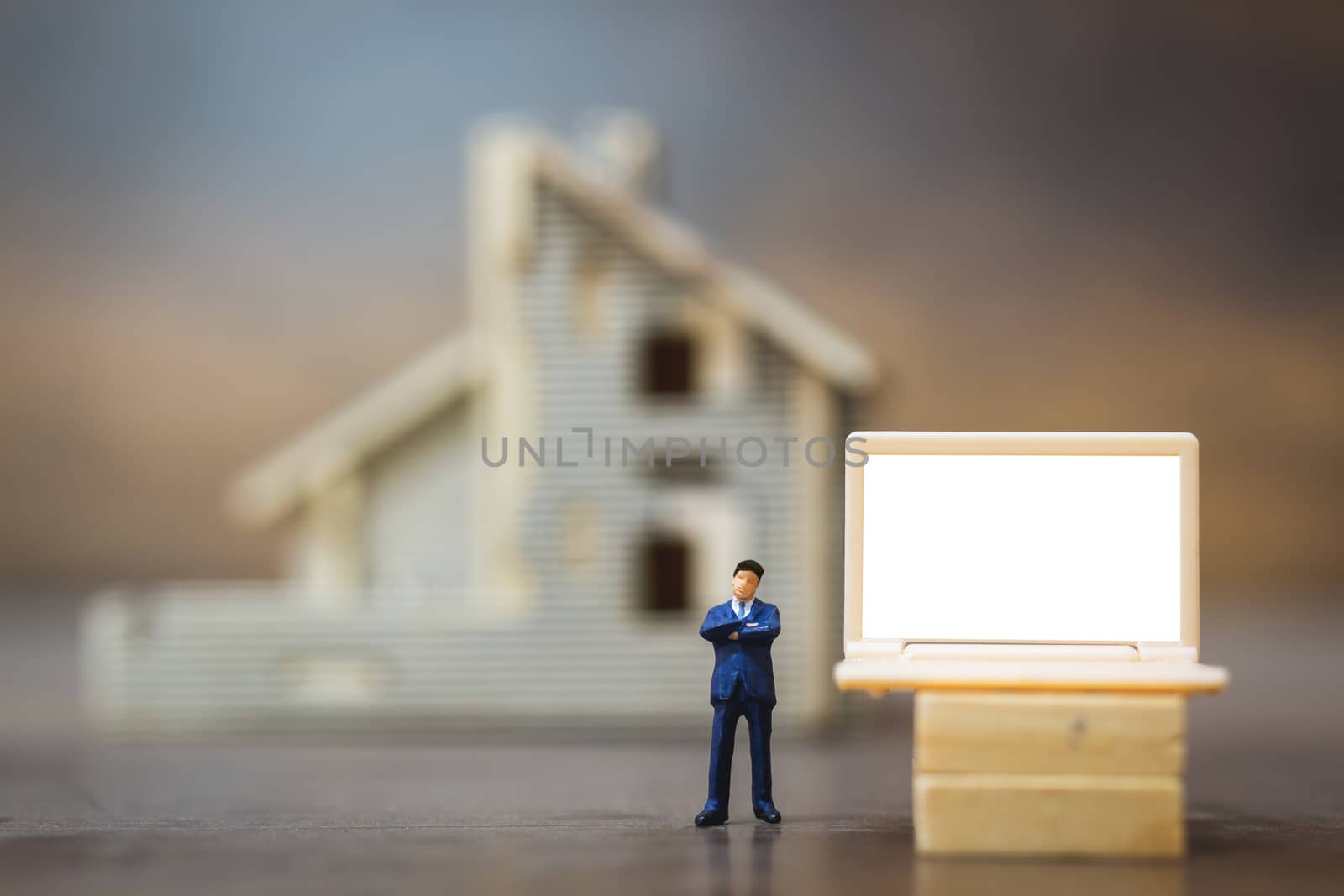 Miniature people business man working with computer labtop , Work at home concept