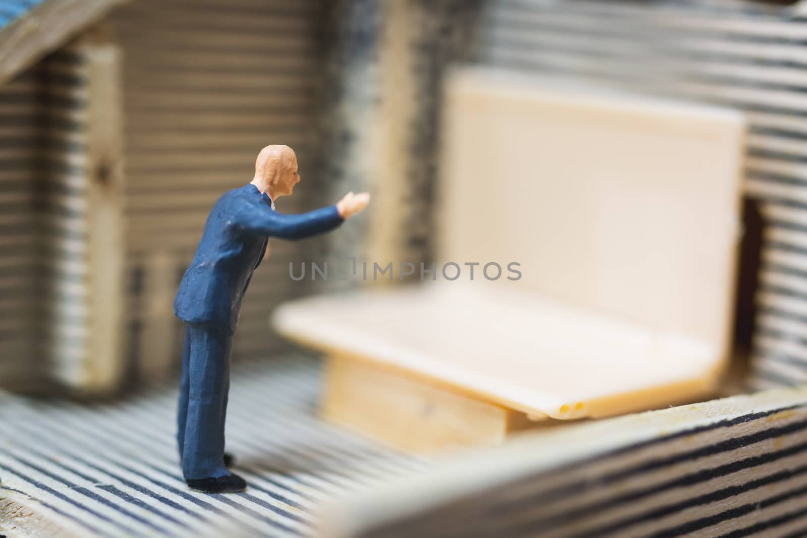 Miniature people business man working with computer labtop , Work at home concept