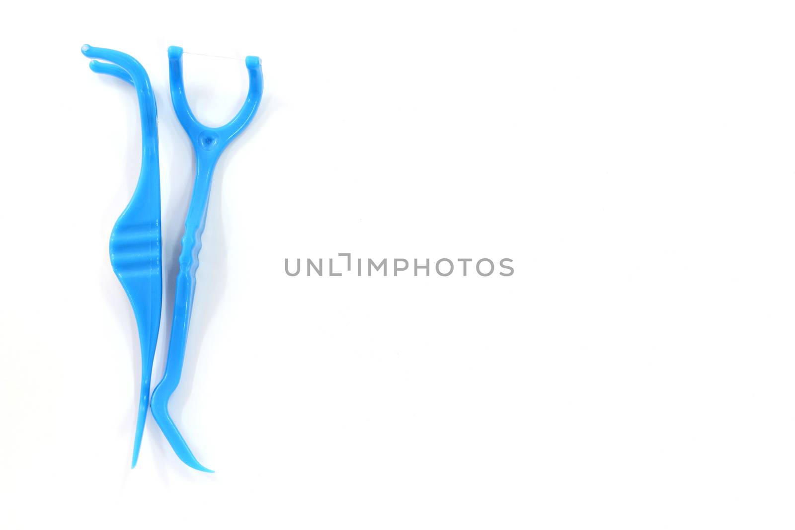 Floss Toothpick isolated on white with a clipping path by sirichaiyaymicro