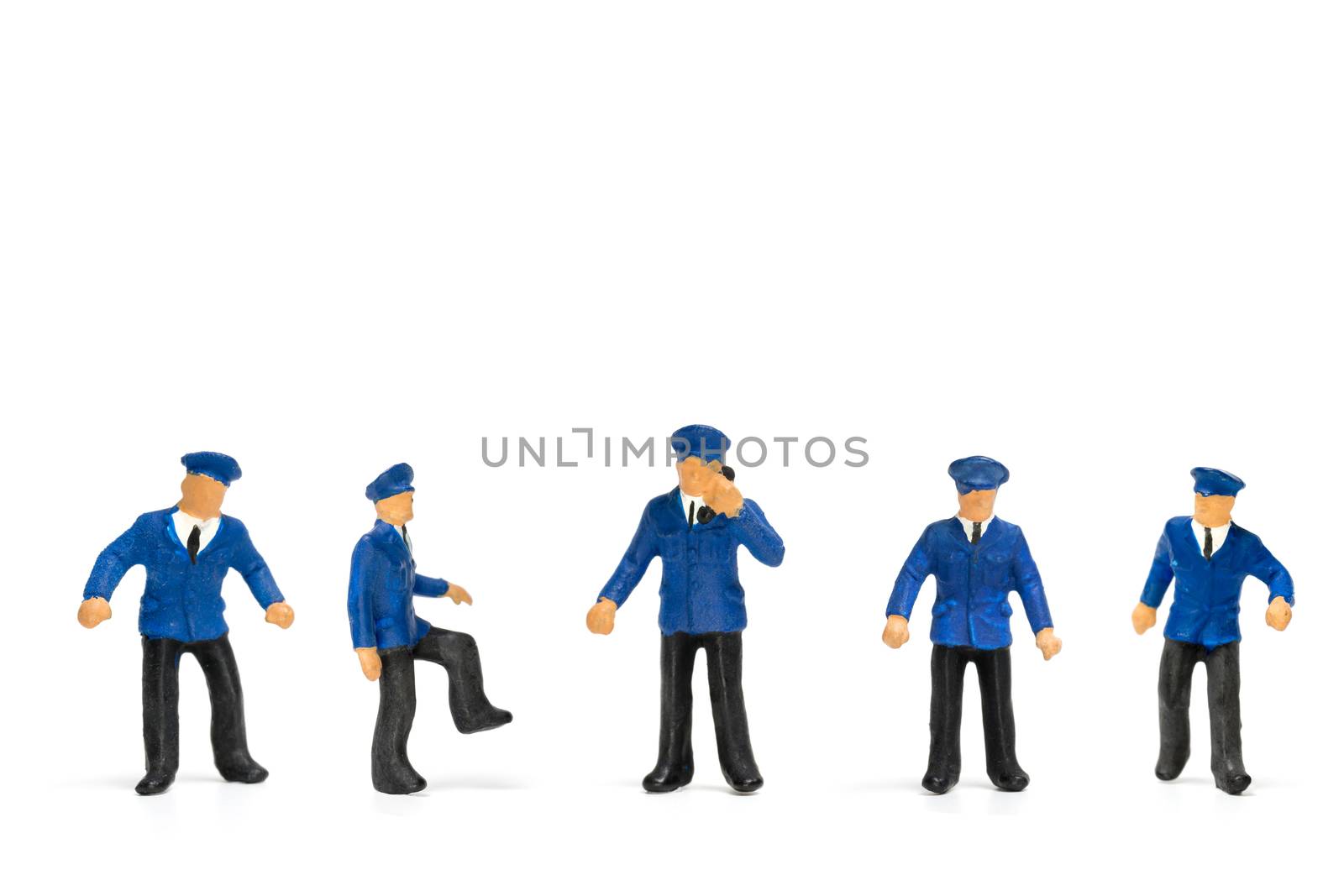 Miniature people : Policeman standing isolate on white background