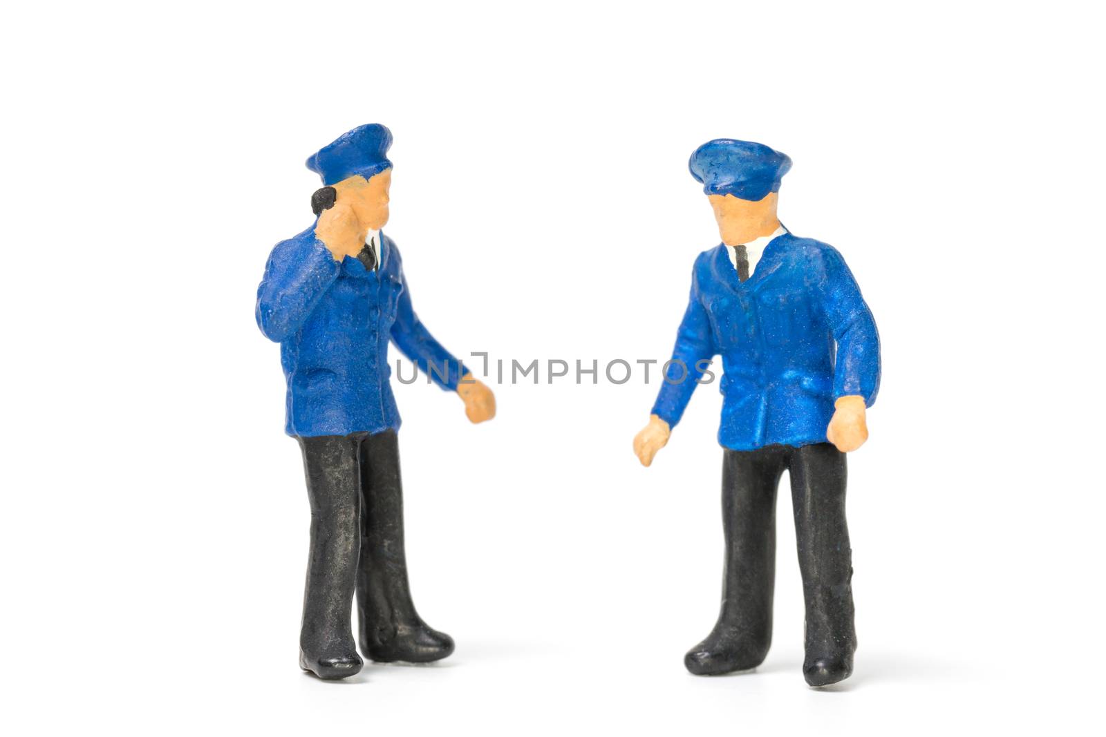 Miniature people : Policeman standing isolate on white background