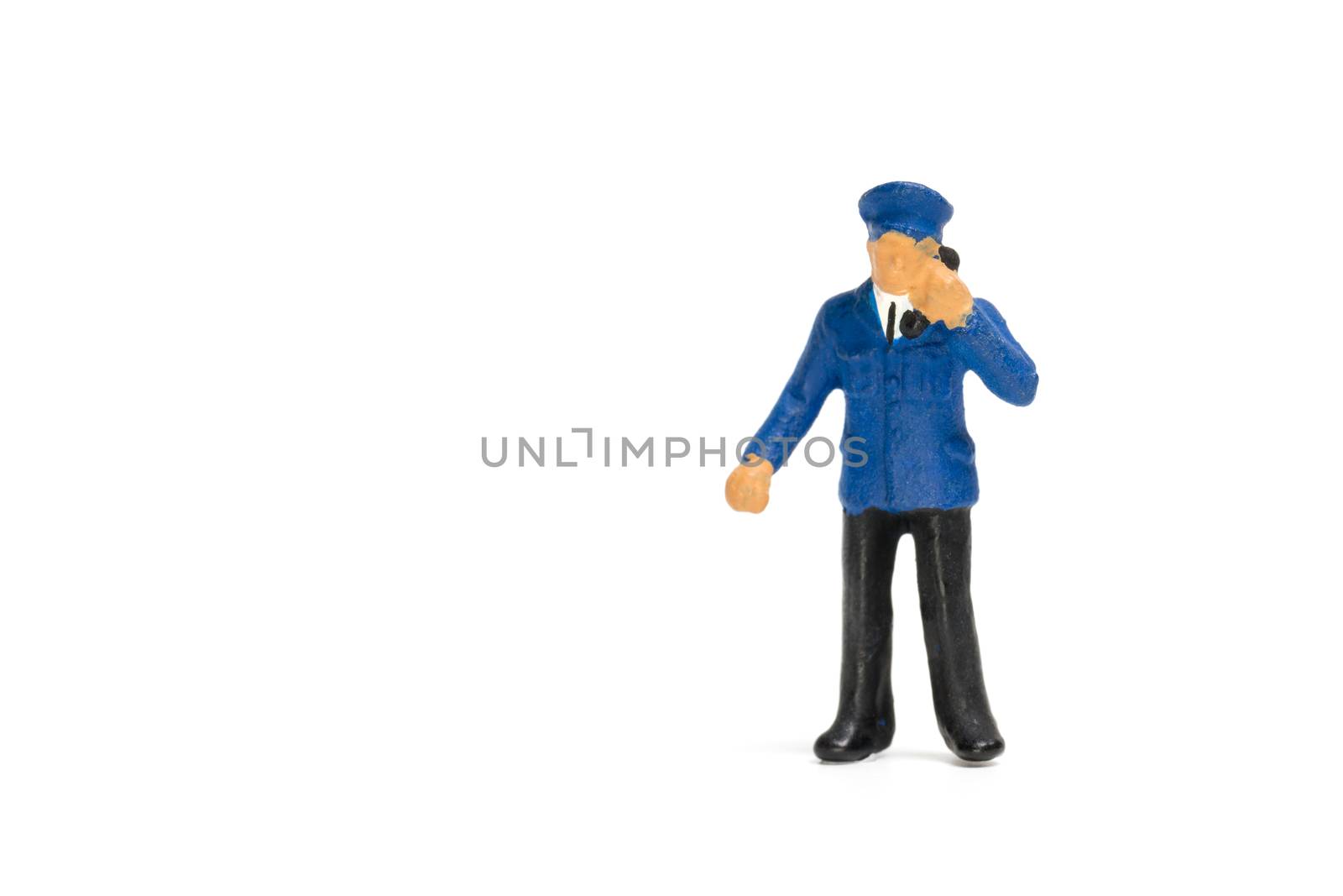 Miniature people : Policeman standing isolate on white background