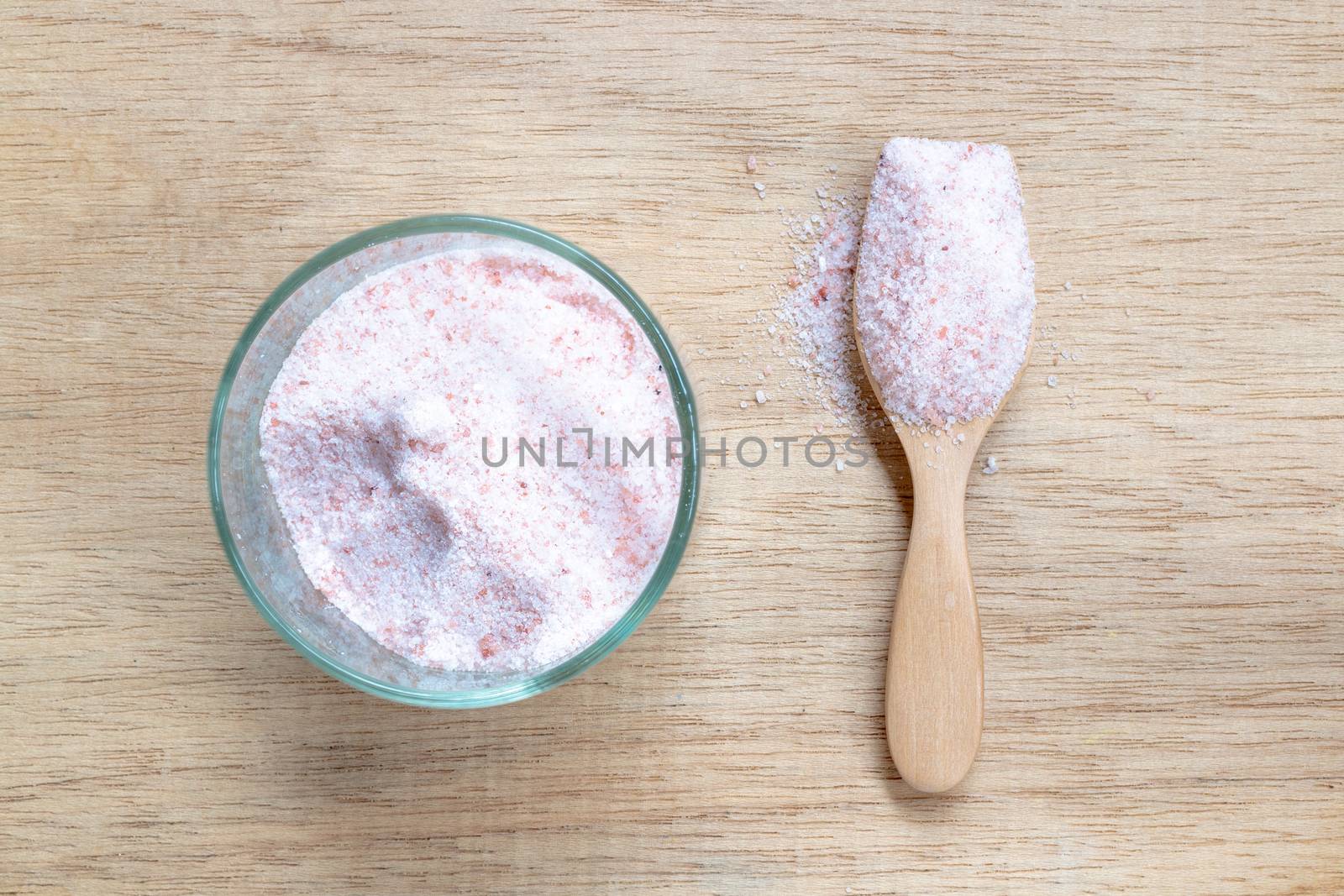 Pink salt , Himalayan salt on wooden background