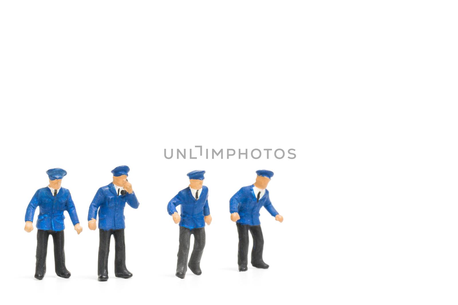 Miniature people : Policeman standing isolate on white background