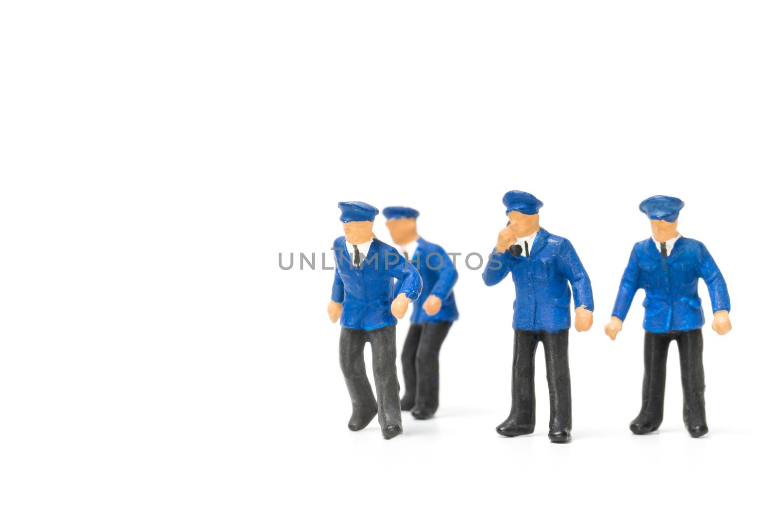 Miniature people : Policeman standing isolate on white background