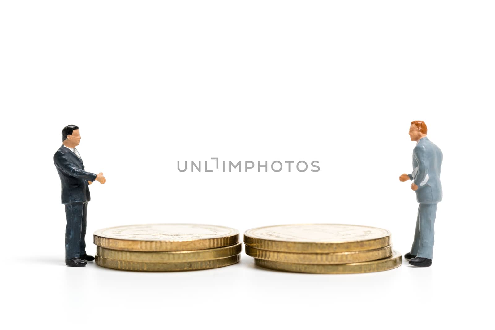 Miniature people: Businessman standing on stack of coin , Money and financial concepts.