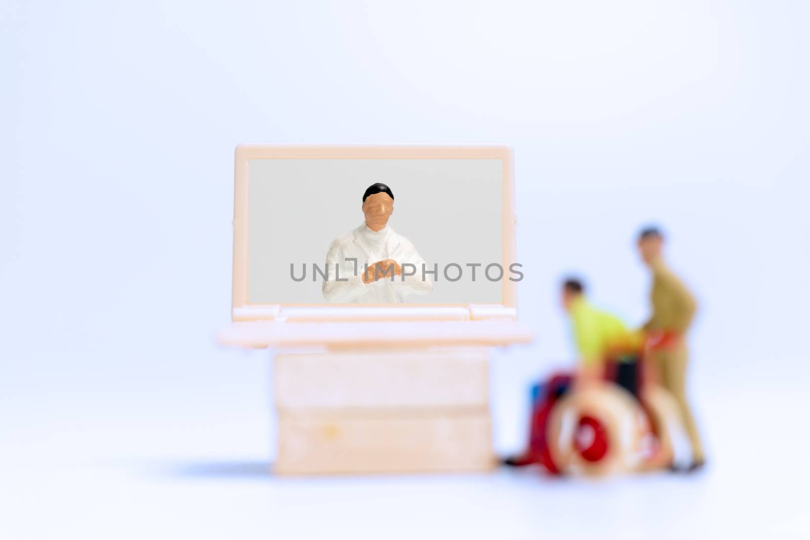 Miniature people , Male patient talk consult with doctor using video call on laptop , online doctor concept