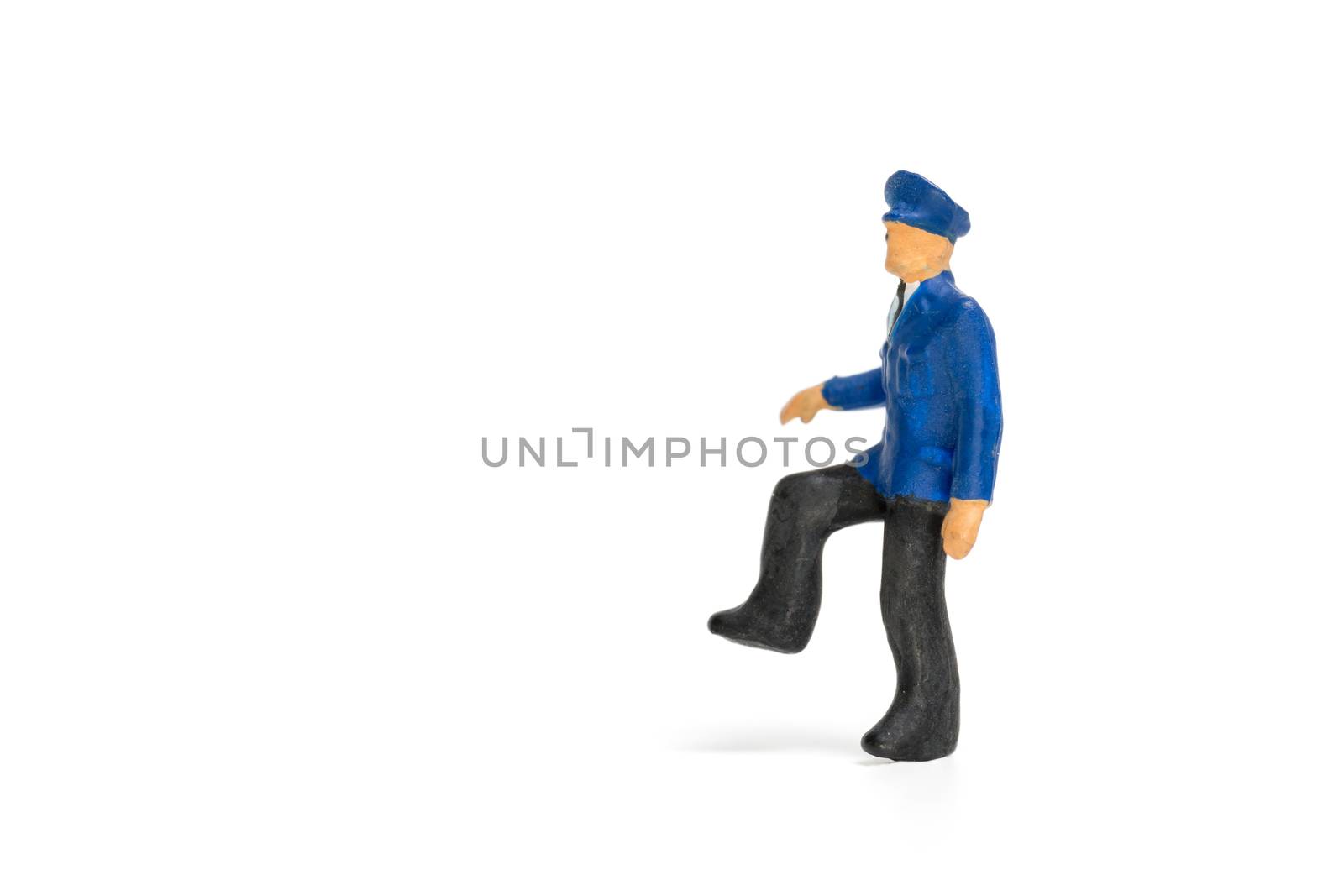 Miniature people : Policeman standing isolate on white background