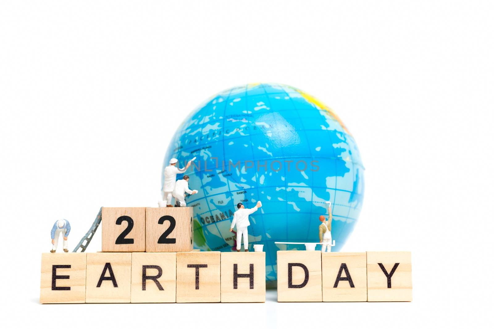 Miniature people : Painters painting on The globe on white background , Earth day concept