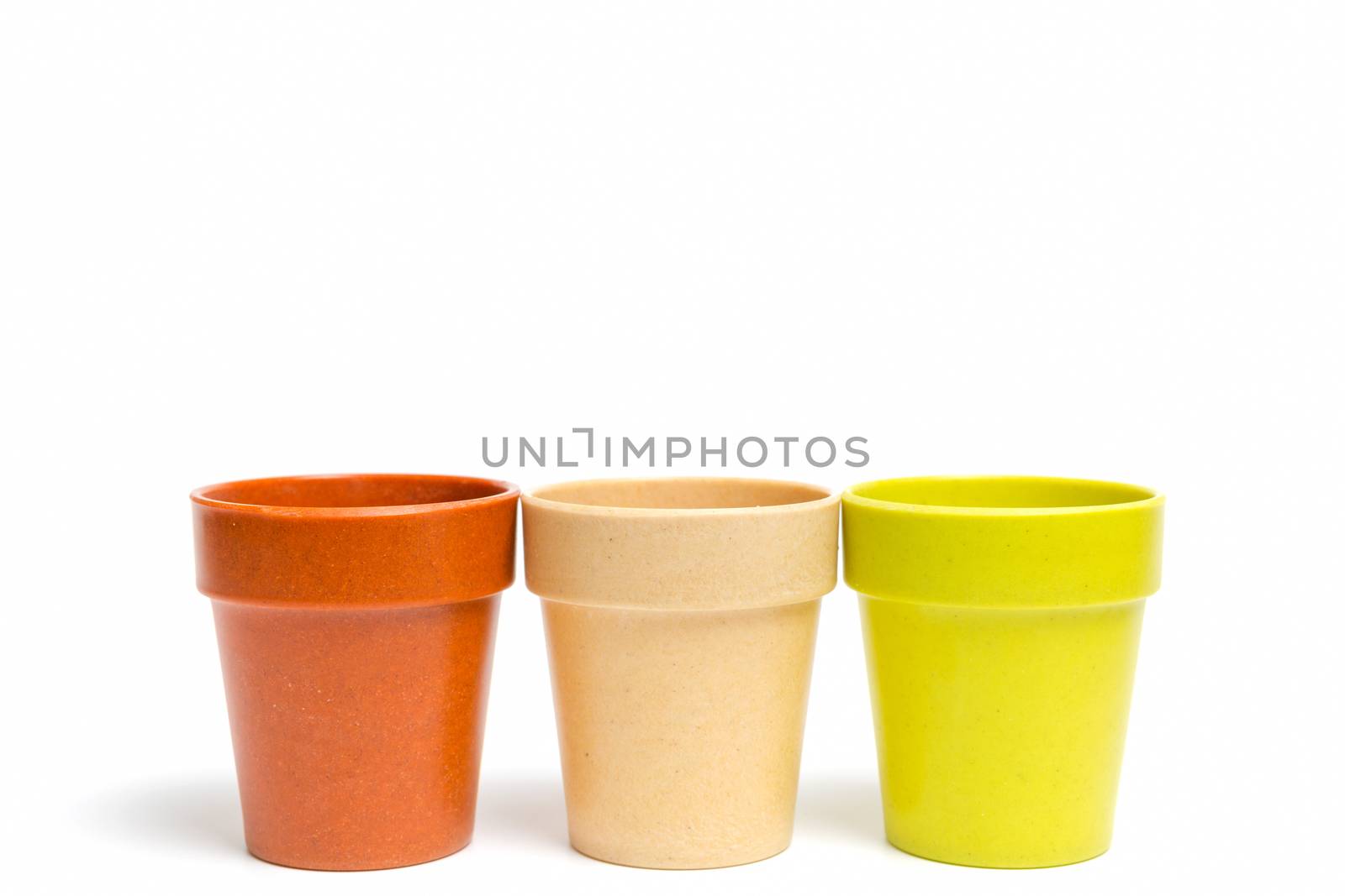 Recycled materials biodegradable tree pot isolated on a white background