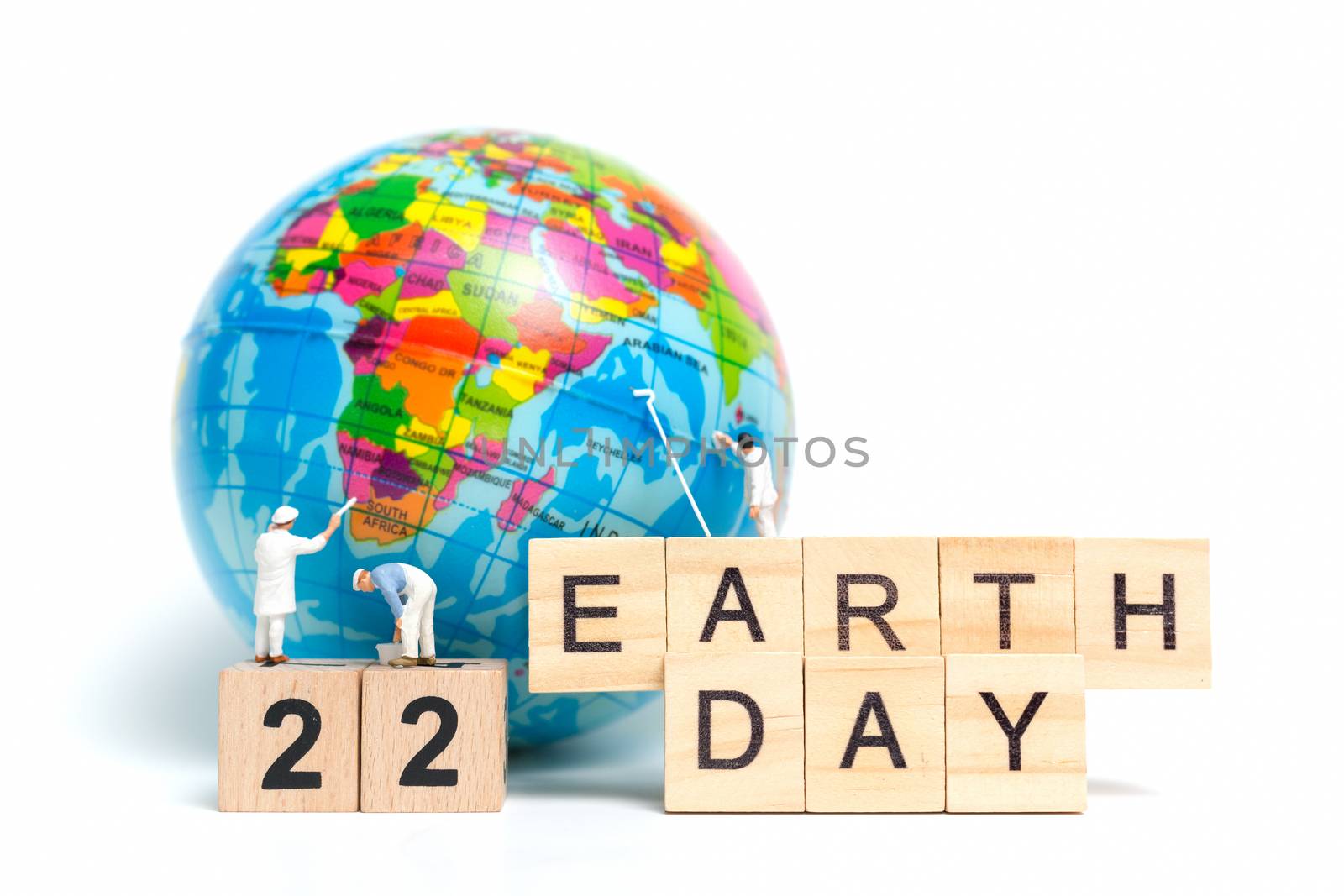 Miniature people : Painters painting on The globe on white background , Earth day concept