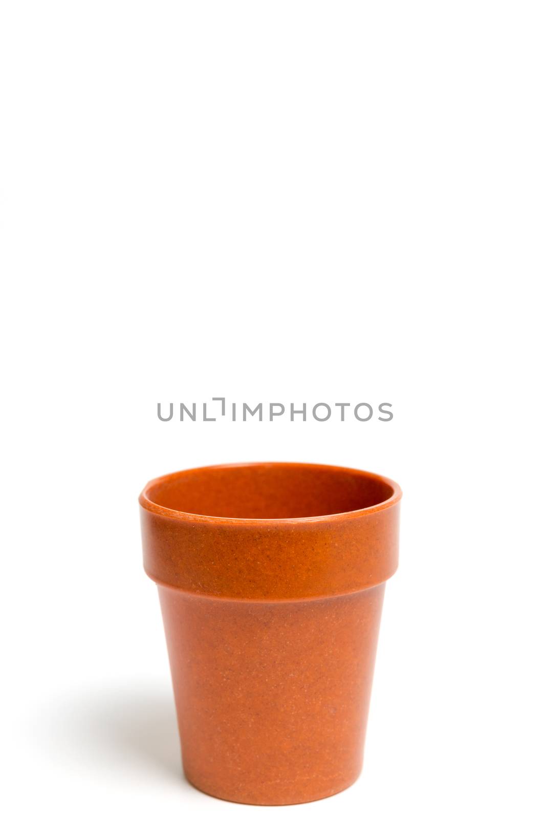 Recycled materials biodegradable tree pot isolated on a white background